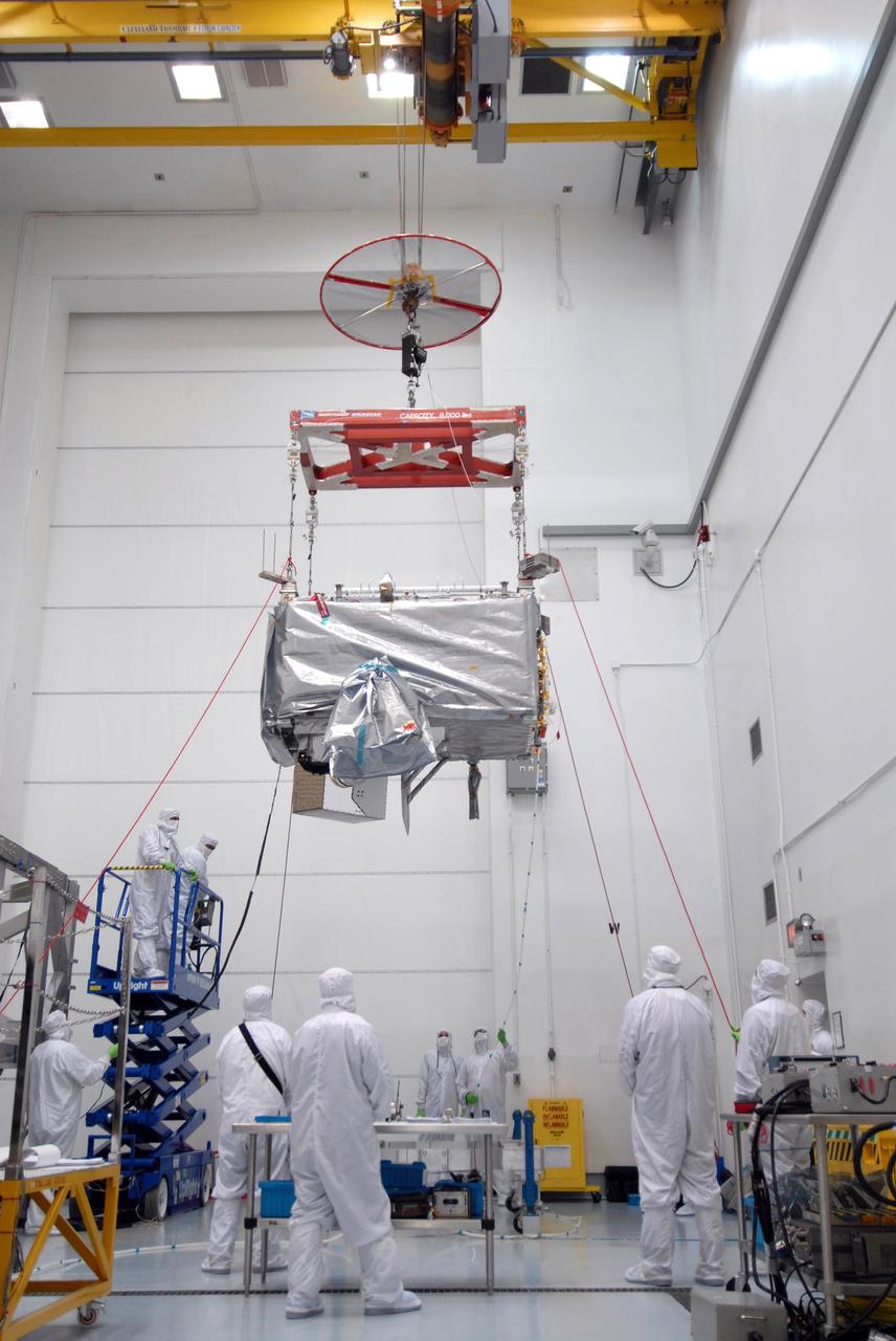 CAPE CANAVERAL, Fla. – In the Astrotech payload processing facility in Titusville, Fla. , the  STSS Demonstrator SV-1 spacecraft is being moved to a stand.  The spacecraft is a midcourse tracking technology demonstrator, part of an evolving ballistic missile defense system. STSS is capable of tracking objects after boost phase and provides trajectory information to other sensors. It will be launched by NASA for the Missile Defense Agency in late summer.  Photo credit: NASA/Tim Jacobs  (Approved for Public Release 09-MDA-4800 [30 July 09] )