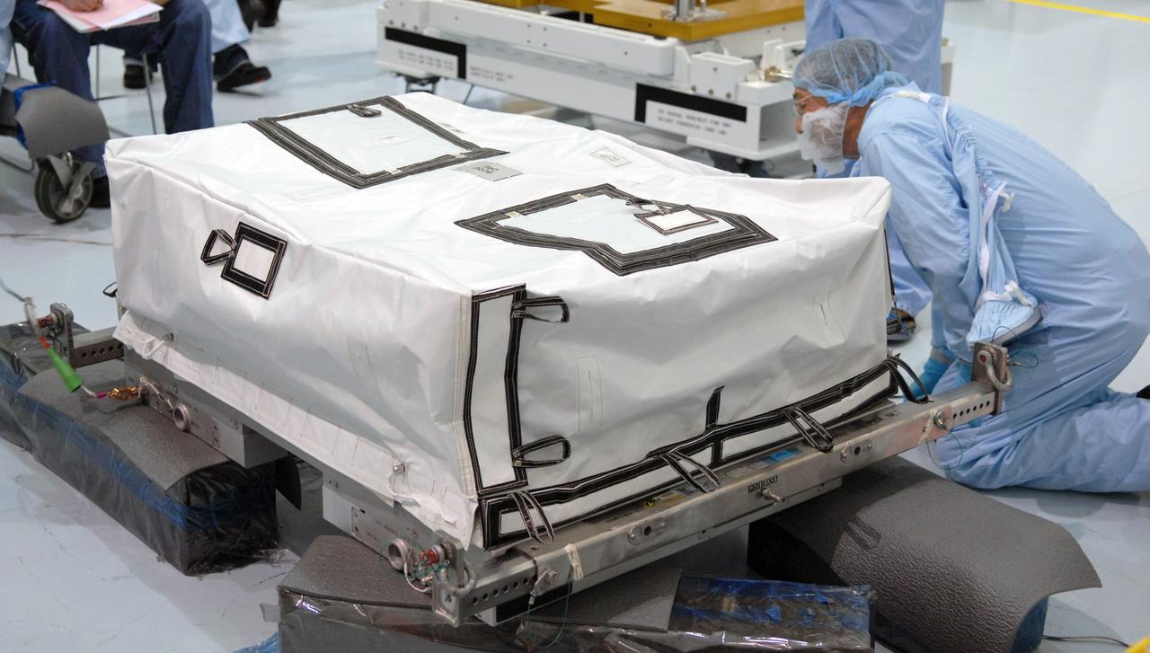 CAPE CANAVERAL, Fla. – In the Space Station Processing Facility at NASA's Kennedy Space Center in Florida, preparations are under way to lift a battery charge-discharge unit from a work stand. The unit will be installed on an EXPRESS Logistics Carrier for flight. The carrier is part of the STS-129 payload on space shuttle Atlantis, which will deliver to the International Space Station two spare gyroscopes, two nitrogen tank assemblies, two pump modules, an ammonia tank assembly and a spare latching end effector for the station's robotic arm. STS-129 is targeted to launch Nov. 12. Photo credit: NASA/Jim Grossmann
