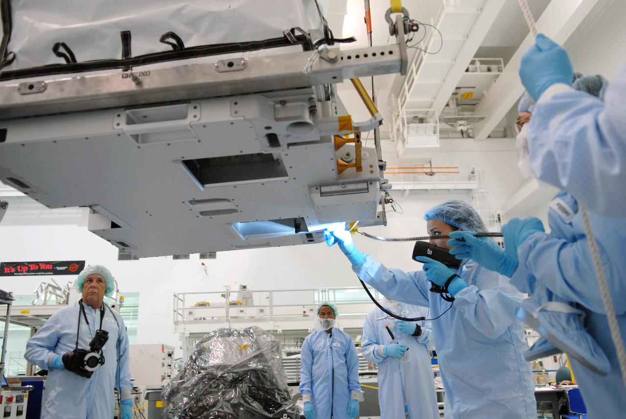 CAPE CANAVERAL, Fla. – In the Space Station Processing Facility at NASA's Kennedy Space Center in Florida, a battery charge-discharge unit gets a thorough inspection after being lifted by crane from a work stand. The unit will be installed on an EXPRESS Logistics Carrier for flight. The carrier is part of the STS-129 payload on space shuttle Atlantis, which will deliver to the International Space Station two spare gyroscopes, two nitrogen tank assemblies, two pump modules, an ammonia tank assembly and a spare latching end effector for the station's robotic arm. STS-129 is targeted to launch Nov. 12. Photo credit: NASA/Jim Grossmann