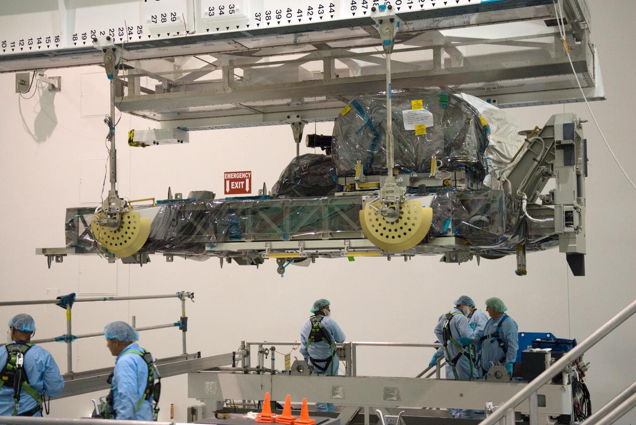 CAPE CANAVERAL, Fla. – In NASA Kennedy Space Center's Space Station Processing Facility, an overhead crane lifts the Express Logistics Carrier, or ELC, from a work stand. The ELC is being moved to a rotation stand. The carrier is part of the STS-129 payload on space shuttle Atlantis, which will deliver to the International Space Station two spare gyroscopes, two nitrogen tank assemblies, two pump modules, an ammonia tank assembly and a spare latching end effector for the station's robotic arm. STS-129 is targeted to launch Nov. 12. Photo credit: NASA/Kim Shiflett