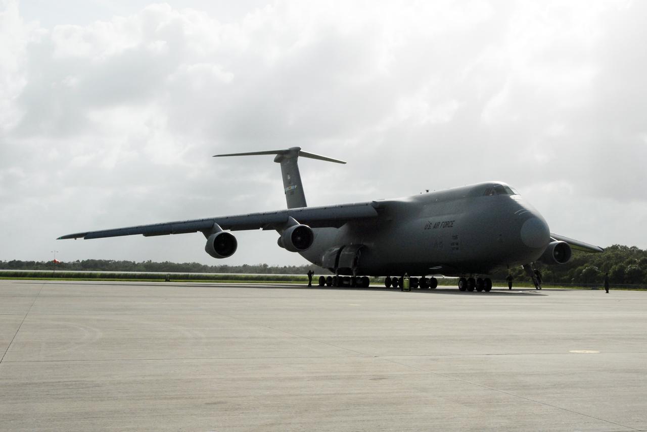 CAPE CANAVERAL, Fla. – The U.S. Air Force C-5 lands on NASA Kennedy Space Center's Shuttle Landing Facility.  The aircraft carries the Express Logistics Carrier 4, or ELC4, part of the payload for the STS-133 mission. Space shuttle Endeavour will deliver the ELC4 and ELC3 with critical spare components to the International Space Station on the mission.  Endeavour's launch is targeted for late July in 2010.  Photo credit: NASA/Amanda Diller