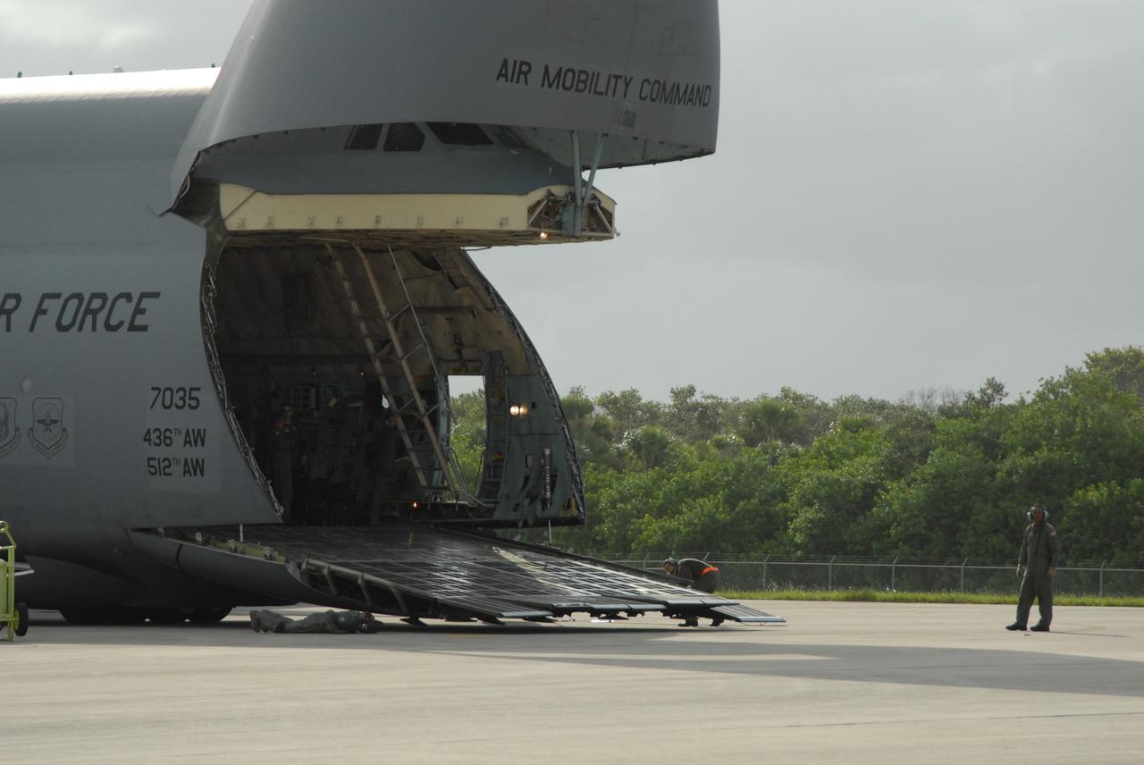 CAPE CANAVERAL, Fla. – On NASA Kennedy Space Center's Shuttle Landing Facility, the ramp on the U.S. Air Force C-5 is down to start offloading its cargo, the Express Logistics Carrier 4, or ELC4. The ELC4 is part of the payload for the STS-133 mission.  Space shuttle Endeavour will deliver the ELC4 and ELC3 with critical spare components to the International Space Station on the mission.  Endeavour's launch is targeted for late July in 2010.  Photo credit: NASA/Amanda Diller