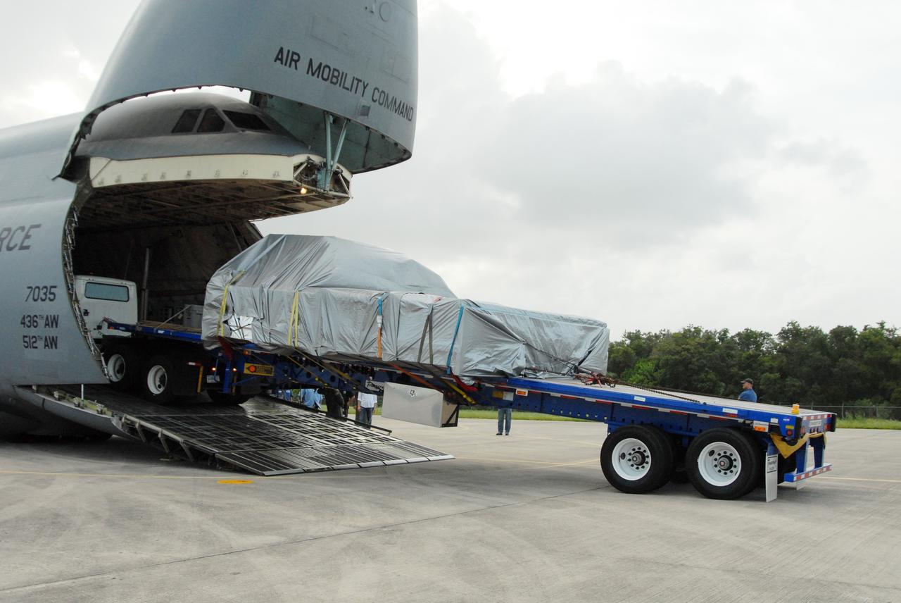 CAPE CANAVERAL, Fla. – On NASA Kennedy Space Center's Shuttle Landing Facility, the Express Logistics Carrier 4, or ELC4, is moved out of the U.S. Air Force C-5. The ELC4 is part of the payload for the STS-133 mission.  Space shuttle Endeavour will deliver the ELC4 and ELC3 with critical spare components to the International Space Station on the mission.  Endeavour's launch is targeted for late July in 2010.  Photo credit: NASA/Amanda Diller