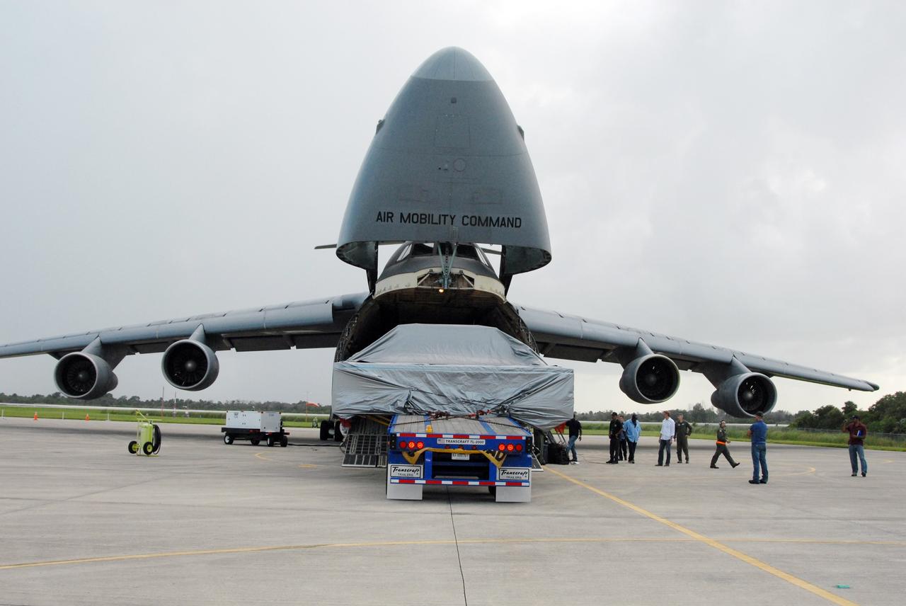 CAPE CANAVERAL, Fla. – On NASA Kennedy Space Center's Shuttle Landing Facility, the Express Logistics Carrier 4, or ELC4, is moved out of the U.S. Air Force C-5. The ELC4 is part of the payload for the STS-133 mission.  Space shuttle Endeavour will deliver the ELC4 and ELC3 with critical spare components to the International Space Station on the mission.  Endeavour's launch is targeted for late July in 2010.  Photo credit: NASA/Amanda Diller