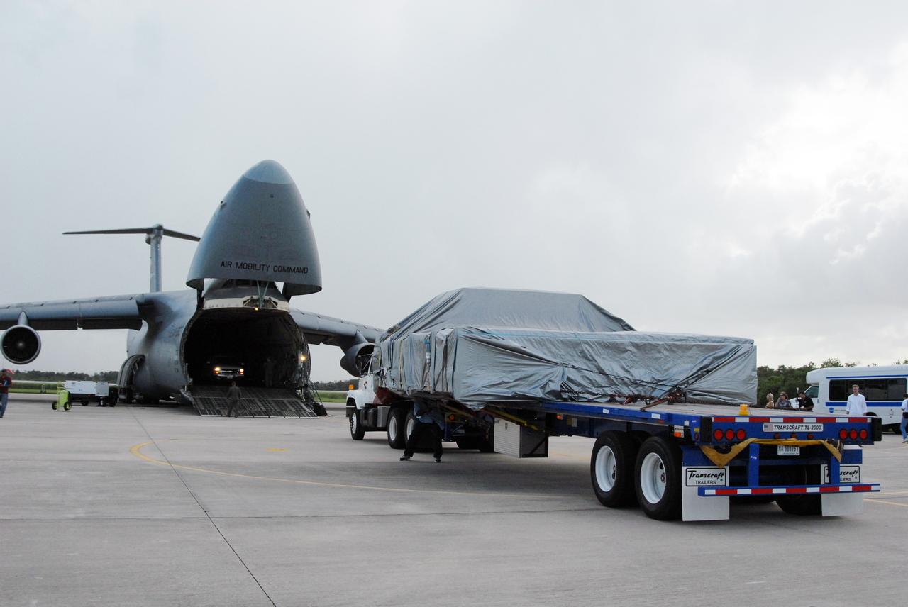 CAPE CANAVERAL, Fla. – On NASA Kennedy Space Center's Shuttle Landing Facility, the Express Logistics Carrier 4, or ELC4, is out of the U.S. Air Force C-5. It will be transported to the Space Station Processing Facility. The ELC4 is part of the payload for the STS-133 mission. Space shuttle Endeavour will deliver the ELC4 and ELC3 with critical spare components to the International Space Station on the mission.  Endeavour's launch is targeted for late July in 2010.  Photo credit: NASA/Amanda Diller