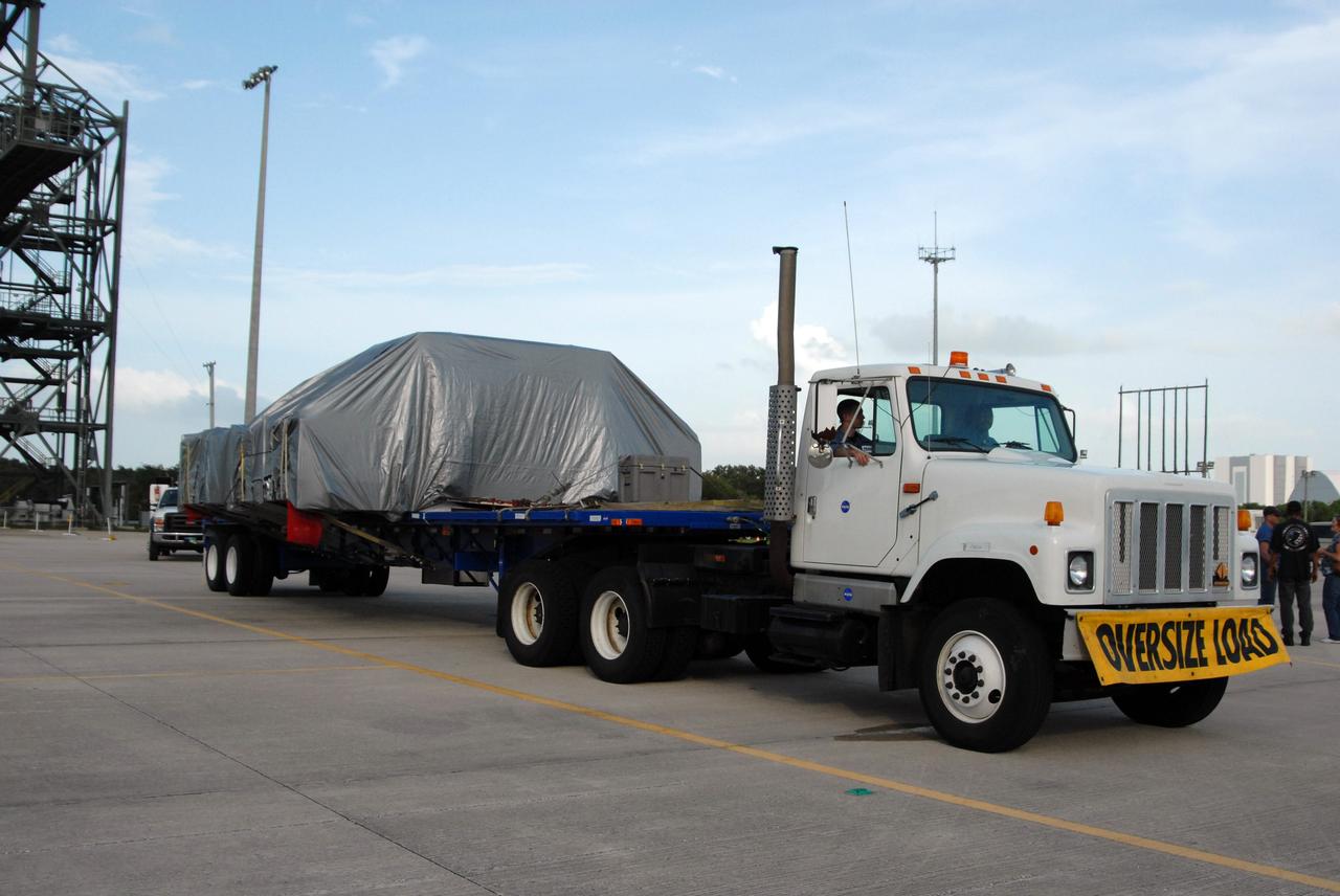CAPE CANAVERAL, Fla. – The truck carrying the Express Logistics Carrier 4, or ELC4, is ready to leave NASA Kennedy Space Center's Shuttle Landing Facility.  The ELC4 is being transported to the Space Station Processing Facility. The ELC4 is part of the payload for the STS-133 mission.   Space shuttle Endeavour will deliver the ELC4 and ELC3 with critical spare components to the International Space Station on the mission.  Endeavour's launch is targeted for late July in 2010.  Photo credit: NASA/Amanda Diller