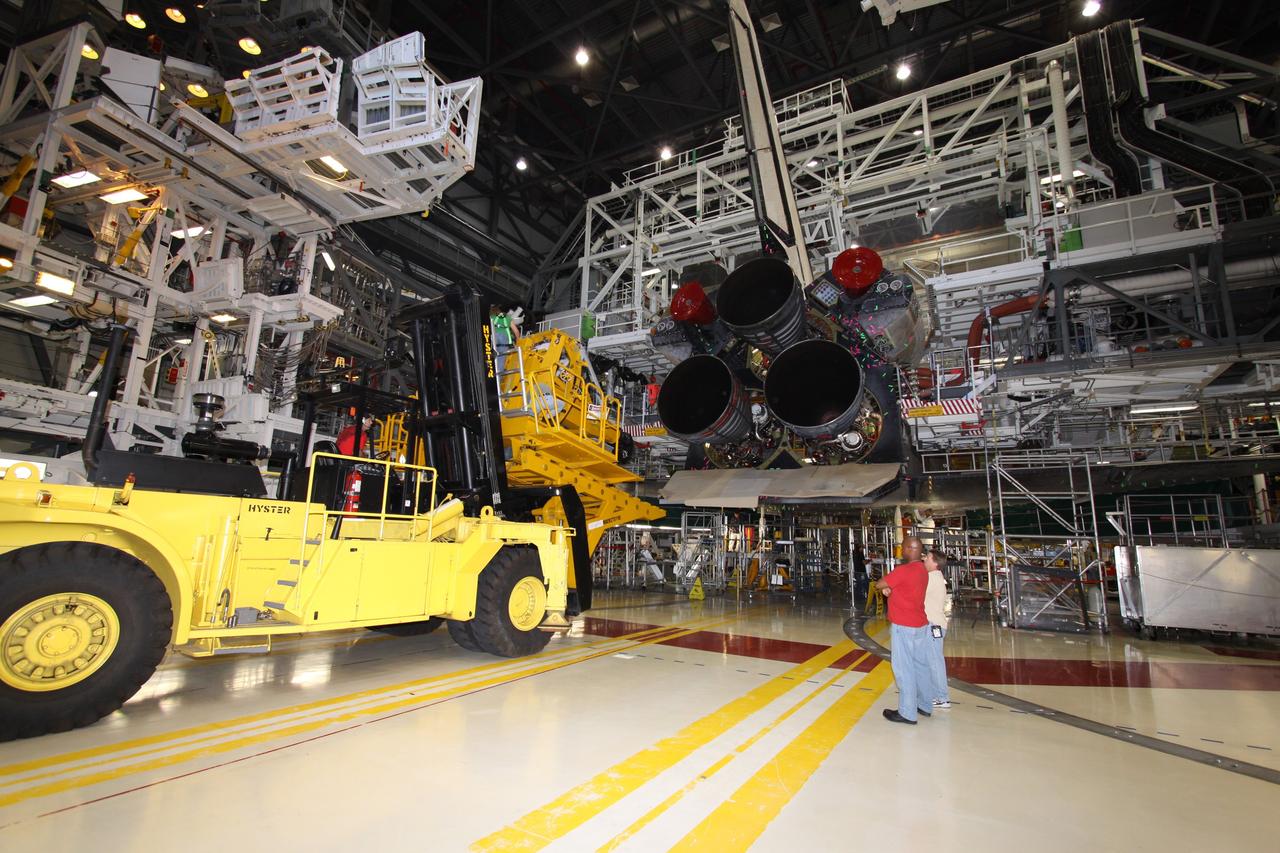 CAPE CANAVERAL, Fla. – In Orbiter Processing Bay 2 at NASA's Kennedy Space Center in Florida, a Hyster forklift is moved into position to remove engine no. 2 from space shuttle Endeavour. Engine removal is part of the post-landing processing. Endeavour returned from the STS-127 mission July 31. Endeavour's next mission is STS-130 targeted for February 2010. Endeavour will deliver to the International Space Station the Tranquility pressurized module that will provide room for many of the station's life support systems. Photo credit: NASA/Jack Pfaller