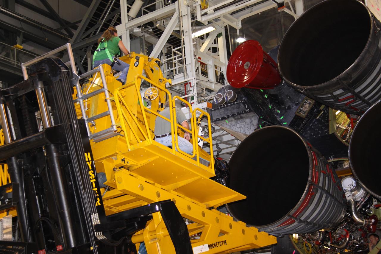 CAPE CANAVERAL, Fla. – In Orbiter Processing Bay 2 at NASA's Kennedy Space Center in Florida, technicians using a Hyster forklift prepare to remove main engine no. 2 on space shuttle Endeavour. Engine removal is part of the post-landing processing. Endeavour returned from the STS-127 mission July 31. Endeavour's next mission is STS-130 targeted for February 2010. Endeavour will deliver to the International Space Station the Tranquility pressurized module that will provide room for many of the station's life support systems. Photo credit: NASA/Jack Pfaller