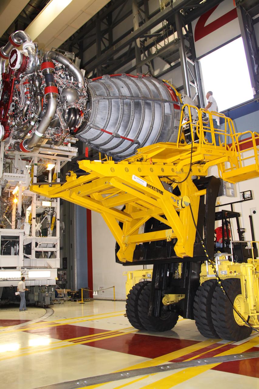 CAPE CANAVERAL, Fla. – In Orbiter Processing Bay 2 at NASA's Kennedy Space Center in Florida, technicians using a Hyster forklift have removed main engine no. 2 from space shuttle Endeavour. Engine removal is part of the post-landing processing. Endeavour returned from the STS-127 mission July 31. Endeavour's next mission is STS-130 targeted for February 2010. Endeavour will deliver to the International Space Station the Tranquility pressurized module that will provide room for many of the station's life support systems. Photo credit: NASA/Jack Pfaller