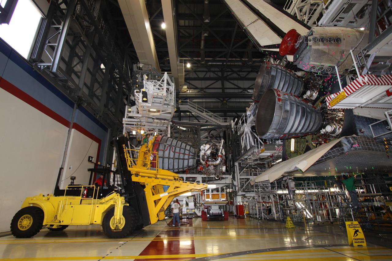 CAPE CANAVERAL, Fla. – In Orbiter Processing Bay 2 at NASA's Kennedy Space Center in Florida, technicians using a Hyster forklift have removed main engine no. 2 from space shuttle Endeavour. Engine removal is part of the post-landing processing. Endeavour returned from the STS-127 mission July 31. Endeavour's next mission is STS-130 targeted for February 2010. Endeavour will deliver to the International Space Station the Tranquility pressurized module that will provide room for many of the station's life support systems. Photo credit: NASA/Jack Pfaller