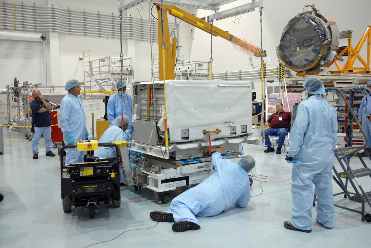 CAPE CANAVERAL, Fla. – In the Space Station Processing Facility at NASA's Kennedy Space Center in Florida, technicians check the nitrogen tank assembly before lifting and moving it to the Express Logistics Carrier 1, or ELC-1. The carrier is part of the STS-129 payload on space shuttle Atlantis, which will deliver to the International Space Station two spare gyroscopes, two nitrogen tank assemblies, two pump modules, an ammonia tank assembly and a spare latching end effector for the station's robotic arm. STS-129 is targeted to launch Nov. 12. Photo credit: NASA/Jim Grossmann