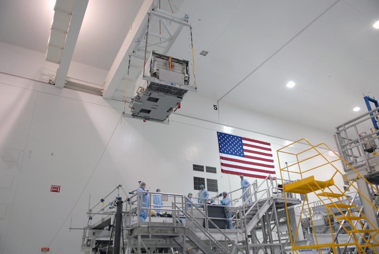 CAPE CANAVERAL, Fla. – In the Space Station Processing Facility at NASA's Kennedy Space Center in Florida, the nitrogen tank assembly is moved toward the Express Logistics Carrier 1, or ELC-1. The carrier is part of the STS-129 payload on space shuttle Atlantis, which will deliver to the International Space Station two spare gyroscopes, two nitrogen tank assemblies, two pump modules, an ammonia tank assembly and a spare latching end effector for the station's robotic arm. STS-129 is targeted to launch Nov. 12. Photo credit: NASA/Jim Grossmann