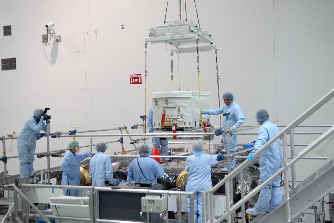 CAPE CANAVERAL, Fla. – In the Space Station Processing Facility at NASA's Kennedy Space Center in Florida, the nitrogen tank assembly is lowered onto the Express Logistics Carrier 1, or ELC-1. The carrier is part of the STS-129 payload on space shuttle Atlantis, which will deliver to the International Space Station two spare gyroscopes, two nitrogen tank assemblies, two pump modules, an ammonia tank assembly and a spare latching end effector for the station's robotic arm. STS-129 is targeted to launch Nov. 12. Photo credit: NASA/Jim Grossmann