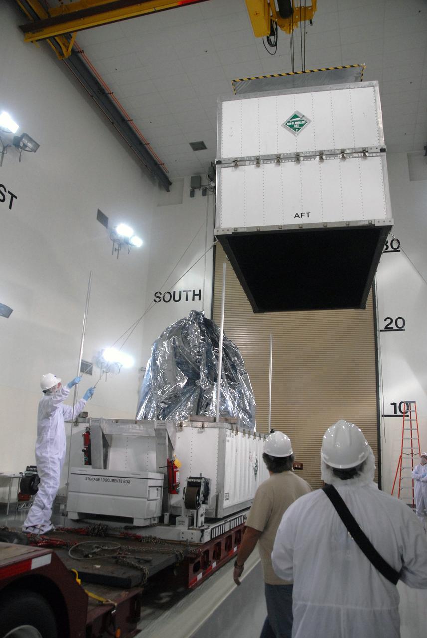 VANDENBERG AIR FORCE BASE, Calif. -- In the Astrotech payload processing facility at Vandenberg Air Force Base in California, the top of the shipping container is removed from NASA's Wide-field Infrared Survey Explorer, or WISE, spacecraft. The satellite will survey the entire sky at infrared wavelengths, creating a cosmic clearinghouse of hundreds of millions of objects,  which will be catalogued, providing a vast storehouse of knowledge about the solar system, the Milky Way, and the universe. Launch is scheduled no earlier than Dec. 10.  Photo credit: NASA/Doug Kolkow, VAFB