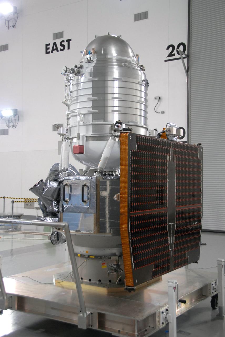 VANDENBERG AIR FORCE BASE, Calif. -- At Vandenberg Air Force Base's Astrotech processing facility in California, NASA's Wide-field Infrared Survey Explorer, or WISE, spacecraft is revealed after the protective cover was removed.  WISE will be moved from the travel dolly it's on to a work stand. The satellite will survey the entire sky at infrared wavelengths, creating a cosmic clearinghouse of hundreds of millions of objects,  which will be catalogued, providing a vast storehouse of knowledge about the solar system, the Milky Way, and the universe. Launch is scheduled no earlier than Dec. 10.  Photo credit: NASA/Moore, VAFB