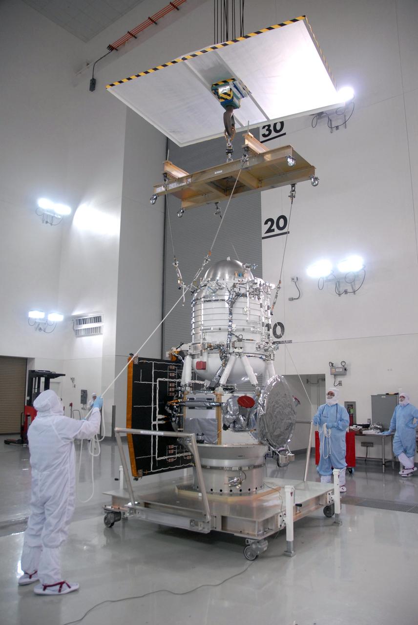 VANDENBERG AIR FORCE BASE, Calif. -- At Vandenberg Air Force Base's Astrotech processing facility in California, an overhead crane is being used to lift NASA's Wide-field Infrared Survey Explorer, or WISE, spacecraft from its travel dolly to a work stand. The satellite will survey the entire sky at infrared wavelengths, creating a cosmic clearinghouse of hundreds of millions of objects,  which will be catalogued, providing a vast storehouse of knowledge about the solar system, the Milky Way, and the universe. Launch is scheduled no earlier than Dec. 10.  Photo credit: NASA/Moore, VAFB