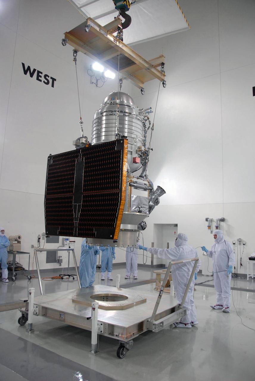 VANDENBERG AIR FORCE BASE, Calif. -- At Vandenberg Air Force Base's Astrotech processing facility in California, workers check NASA's Wide-field Infrared Survey Explorer, or WISE, spacecraft as it is lifted from its travel dolly.  WISE will be moved to a work stand. The satellite will survey the entire sky at infrared wavelengths, creating a cosmic clearinghouse of hundreds of millions of objects,  which will be catalogued, providing a vast storehouse of knowledge about the solar system, the Milky Way, and the universe. Launch is scheduled no earlier than Dec. 10.  Photo credit: NASA/Moore, VAFB