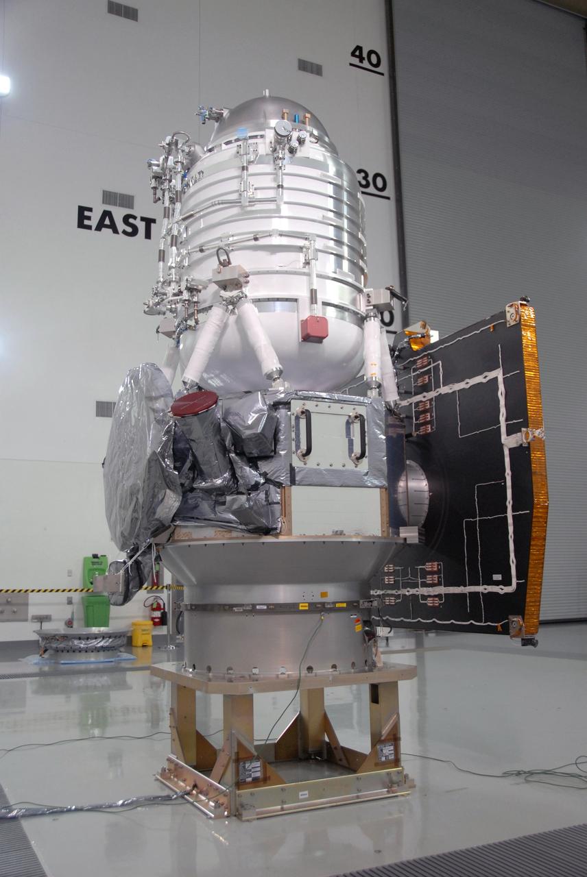 VANDENBERG AIR FORCE BASE, Calif. -- At Vandenberg Air Force Base's Astrotech processing facility in California, NASA's Wide-field Infrared Survey Explorer, or WISE, spacecraft is situated on a work stand. At right is the fixed panel solar array. The satellite will survey the entire sky at infrared wavelengths, creating a cosmic clearinghouse of hundreds of millions of objects, which will be catalogued, providing a vast storehouse of knowledge about the solar system, the Milky Way, and the universe. Launch is scheduled no earlier than Dec. 10. Photo credit: NASA/Moore, VAFB