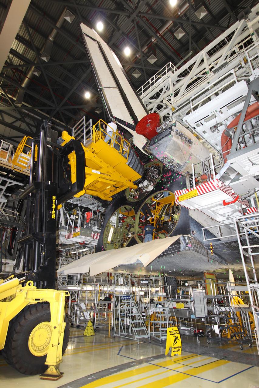 CAPE CANAVERAL, Fla. – In Orbiter Processing Bay 2 at NASA's Kennedy Space Center in Florida, a Hyster forklift is moved into position to remove main engine no. 1 from space shuttle Endeavour.  Engine removal is part of the post-landing processing; engine no. 2 was removed Aug. 17. Endeavour returned from the STS-127 mission July 31. Endeavour's next mission is STS-130 targeted for February 2010.  Endeavour will deliver to the International Space Station the Tranquility pressurized module that will provide room for many of the station's life support systems.   Photo credit: NASA/Jack Pfaller