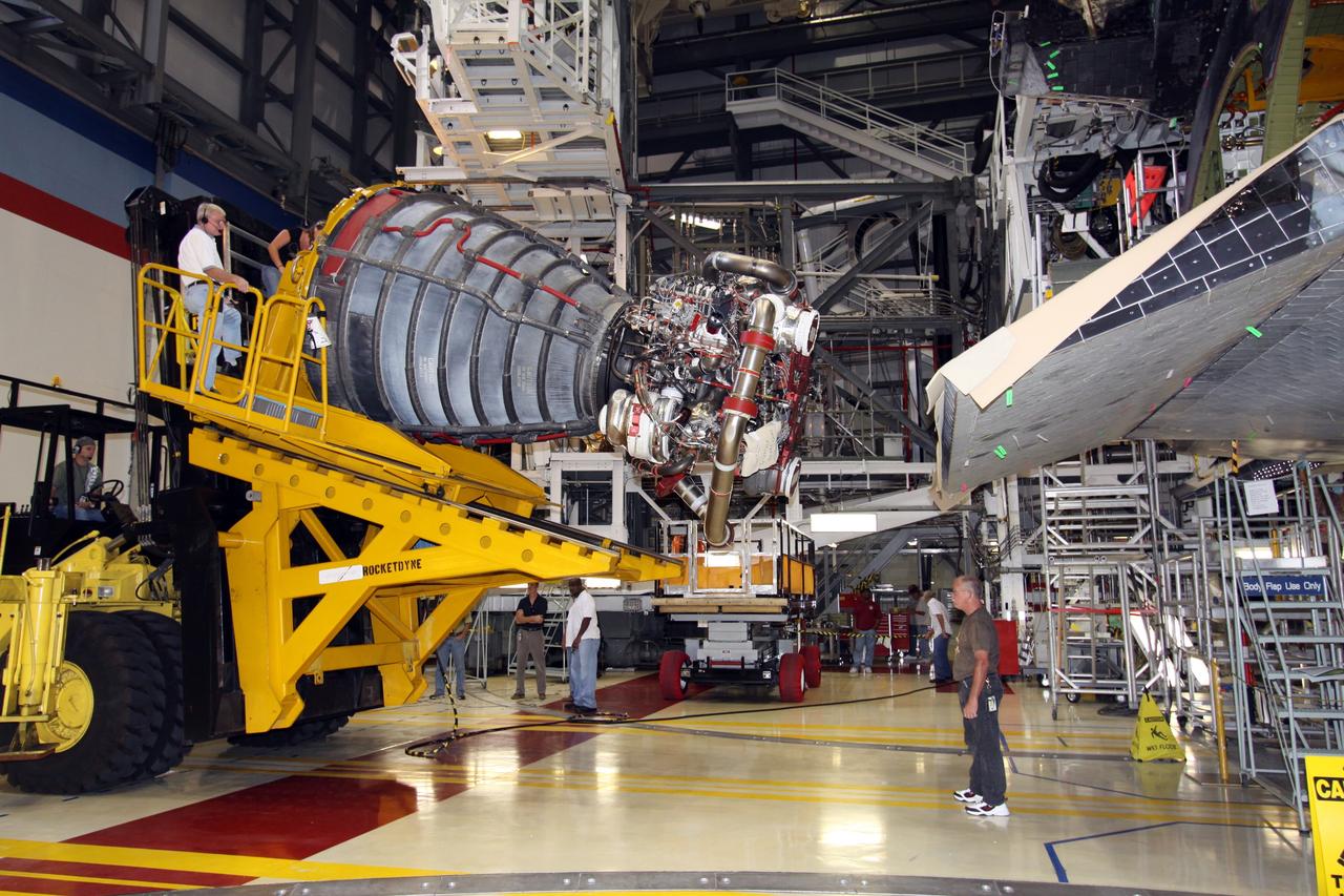 CAPE CANAVERAL, Fla. – In Orbiter Processing Bay 2 at NASA's Kennedy Space Center in Florida,  the Hyster forklift holds main engine no. 1 removed from space shuttle Endeavour. Engine removal is part of the post-landing processing; engine no. 2 was removed Aug. 17. Endeavour returned from the STS-127 mission July 31. Endeavour's next mission is STS-130 targeted for February 2010.  Endeavour will deliver to the International Space Station the Tranquility pressurized module that will provide room for many of the station's life support systems.   Photo credit: NASA/Jack Pfaller
