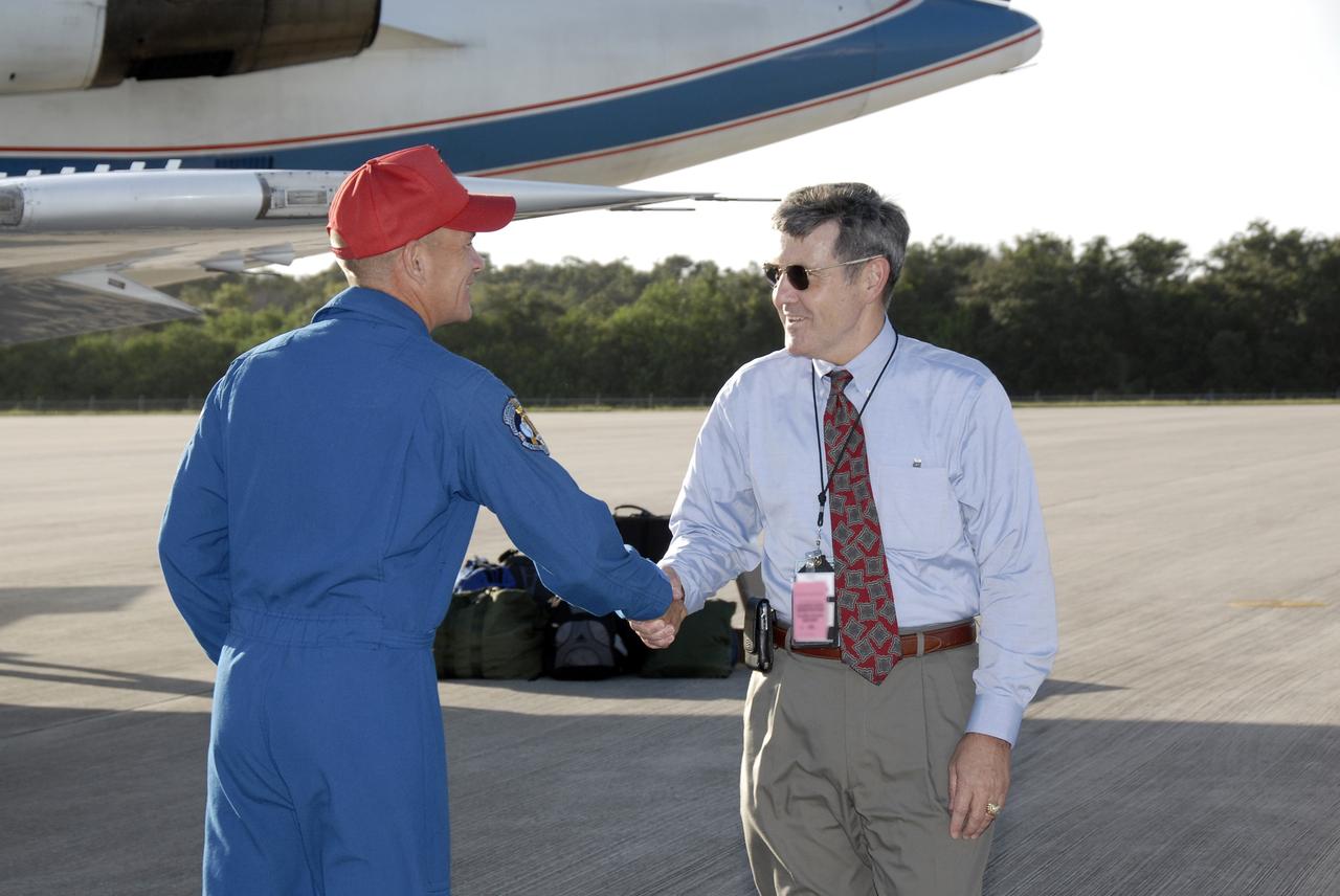 CAPE CANAVERAL, Fla. – STS-128 Commander Rick Sturckow is welcomed to Kennedy Space Center by Center Director Bob Cabana, a former astronaut himself. Sturckow will be making his fourth spaceflight. Space shuttle Discovery's STS-128 mission crew members arrived in a NASA Shuttle Training Aircraft, a modified Gulfstream II jet, at Kennedy's Shuttle Landing Facility at 6:34 p.m. EDT.  The crew has returned to Kennedy to prepare for launch on Aug. 25 at 1:36 a.m. EDT. The 13-day mission will deliver a new crew member and 33,000 pounds of equipment to the International Space Station. The equipment includes science and storage racks, a freezer to store research samples, a new sleeping compartment and the COLBERT treadmill.  Photo credit: NASA/Kim Shiflett