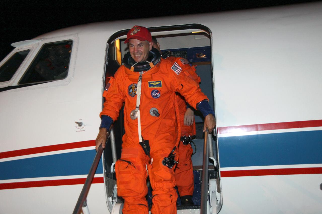 CAPE CANAVERAL, Fla. – At NASA Kennedy Space Center's Shuttle Landing Facility, STS-128 Commander Rick Sturckow exits the Shuttle Training Aircraft after completing practice shuttle landings as preparation for space shuttle Discovery's launch Aug. 25 on the STS-128 mission. The 13-day mission will deliver a new crew member and 33,000 pounds of equipment to the International Space Station. The equipment includes science and storage racks, a freezer to store research samples, a new sleeping compartment and the COLBERT treadmill. Photo credit: NASA/Troy Cryder