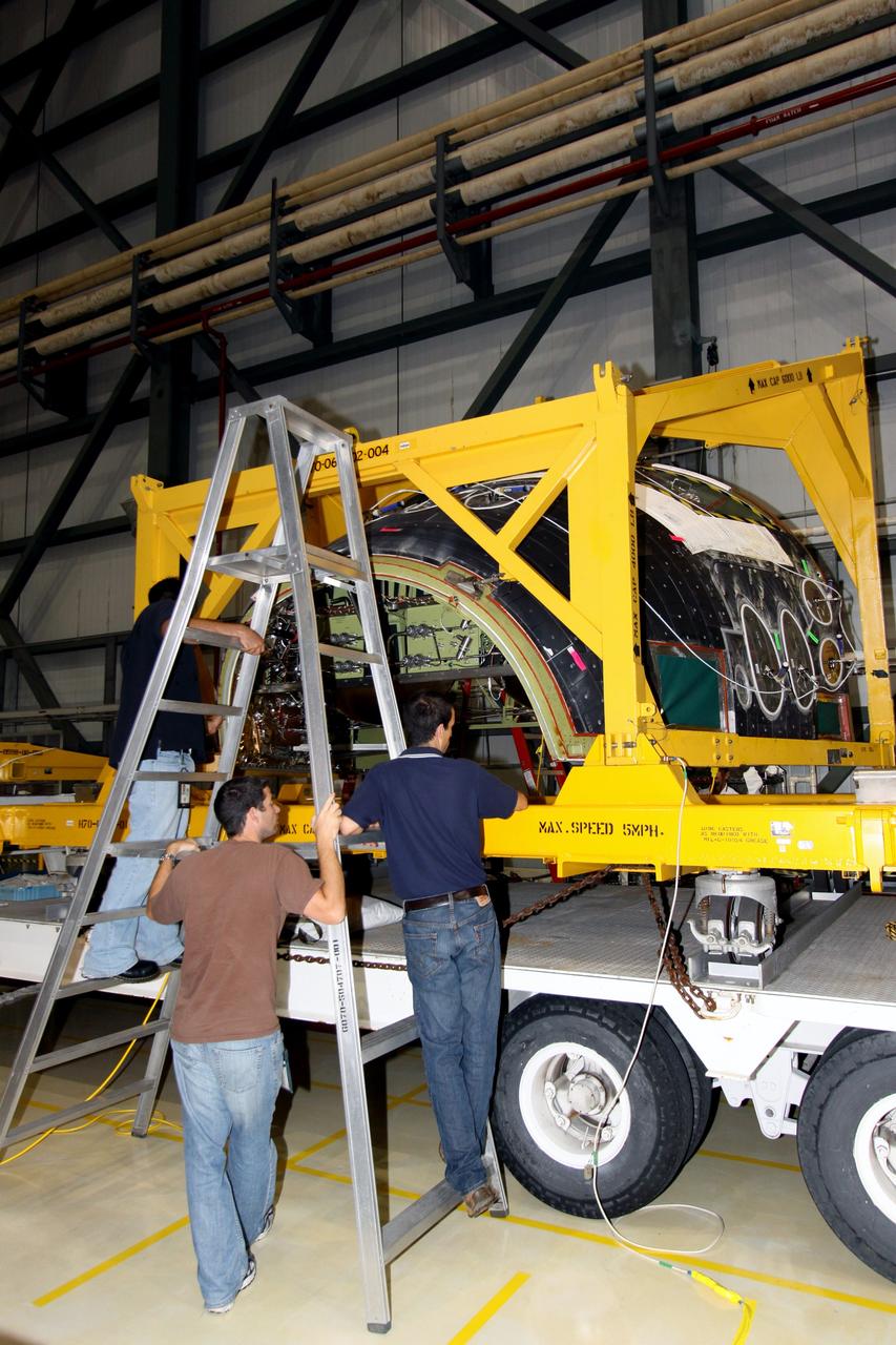 CAPE CANAVERAL, Fla. – In NASA Kennedy Space Center's Orbiter Processing Facility 2, workers prepare to remove the forward reaction control system, or FRCS, from space shuttle Endeavour's forward fuselage nose area. The FRCS provides the thrust for attitude (rotational) maneuvers (pitch, yaw and roll) and for small velocity changes along the orbiter axis (translation maneuvers). Endeavour is designated as the shuttle for the STS-130 mission, targeted for launch in February 2010. Photo credit: NASA/Jack Pfaller