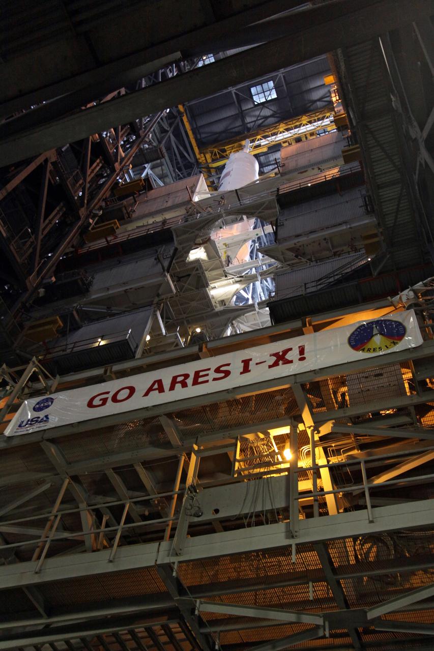 CAPE CANAVERAL, Fla. – Platforms surround the 327-foot tall Ares I-X rocket in NASA Kennedy Space Center's Vehicle Assembly Building.  The rocket is stacked on the mobile launcher platform in High Bay 3.  Five super stacks make up the upper stage that are integrated with the four-segment solid rocket booster first stage below.  Ares I-X is the test vehicle for the Ares I, which is part of the Constellation Program to return men to the moon and beyond. The Ares I-X flight test is targeted for  Oct. 31.  Photo credit: NASA/Jack Pfaller