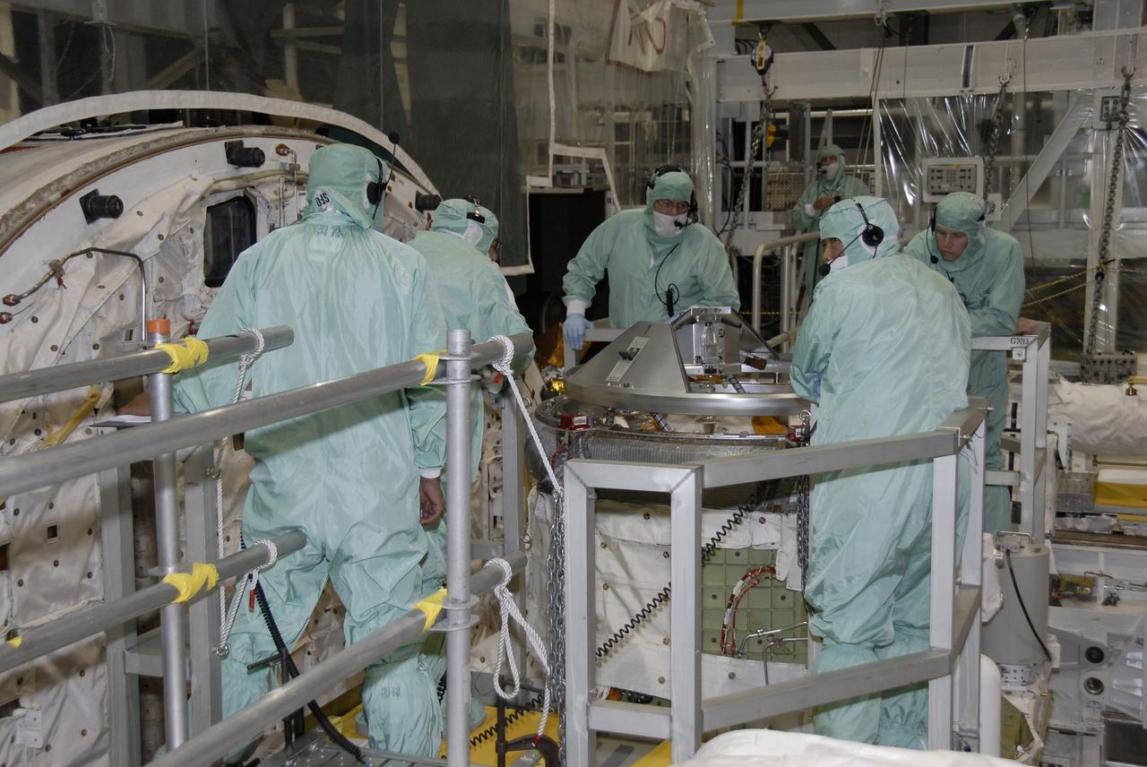 CAPE CANAVERAL, Fla. – In NASA Kennedy Space Center's Orbiter Processing Facility 1, technicians prepare to test the orbital docking system on space shuttle Atlantis.  The STS-129 mission will deliver to the International Space Station two spare gyroscopes, two nitrogen tank assemblies, two pump modules, an ammonia tank assembly and a spare latching end effector for the station's robotic arm. STS-129 is targeted to launch Nov. 12. Photo credit: NASA/Kim Shiflett