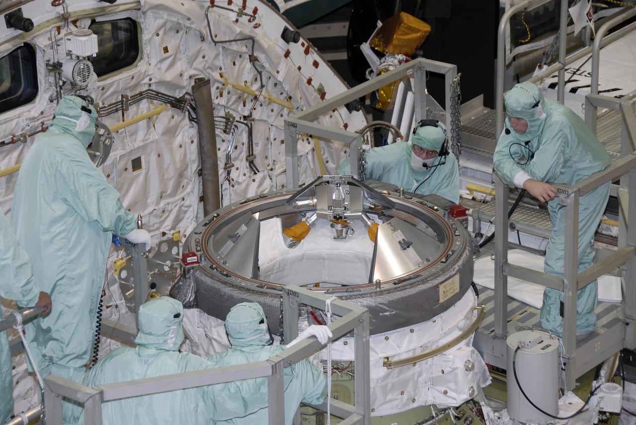 CAPE CANAVERAL, Fla. – In NASA Kennedy Space Center's Orbiter Processing Facility 1, technicians begin testing the orbital docking system on space shuttle Atlantis. The STS-129 mission will deliver to the International Space Station two spare gyroscopes, two nitrogen tank assemblies, two pump modules, an ammonia tank assembly and a spare latching end effector for the station's robotic arm. STS-129 is targeted to launch Nov. 12. Photo credit: NASA/Kim Shiflett