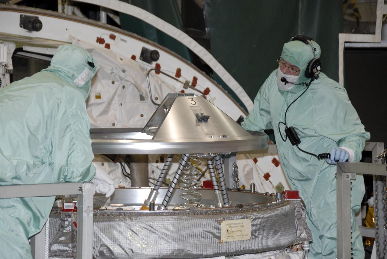 CAPE CANAVERAL, Fla. – In NASA Kennedy Space Center's Orbiter Processing Facility 1, technicians begin a functional test on the orbital docking system on space shuttle Atlantis. The STS-129 mission will deliver to the International Space Station two spare gyroscopes, two nitrogen tank assemblies, two pump modules, an ammonia tank assembly and a spare latching end effector for the station's robotic arm. STS-129 is targeted to launch Nov. 12. Photo credit: NASA/Kim Shiflett