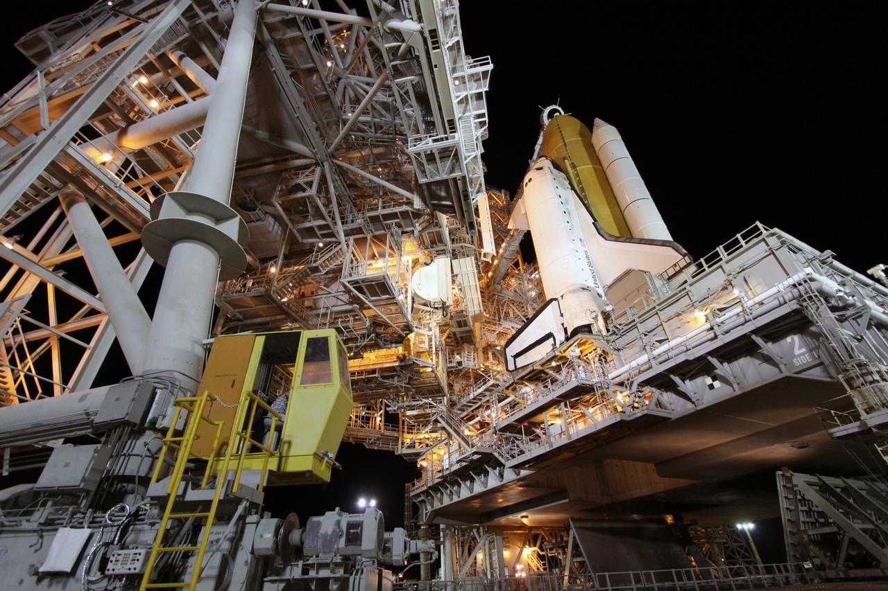 CAPE CANAVERAL, Fla. – On Launch Pad 39A at NASA's Kennedy Space Center in Florida, technicians in the rotating service structure's control booth begin to roll the structure from space shuttle Discovery. First motion was at 5:06 a.m. EDT. The rollback is preparation for Discovery's scheduled 1:36 a.m. EDT liftoff Aug. 25 with a crew of seven. The service structure provides weather protection and access to the space shuttle at the launch pad. The 13-day mission will deliver a new crew member and 33,000 pounds of equipment to the International Space Station. The equipment includes science and storage racks, a freezer to store research samples, a new sleeping compartment and the COLBERT treadmill. STS-128 will be Discovery's 37th mission and the 30th shuttle flight dedicated to station assembly and maintenance. Photo credit: NASA/Troy Cryder