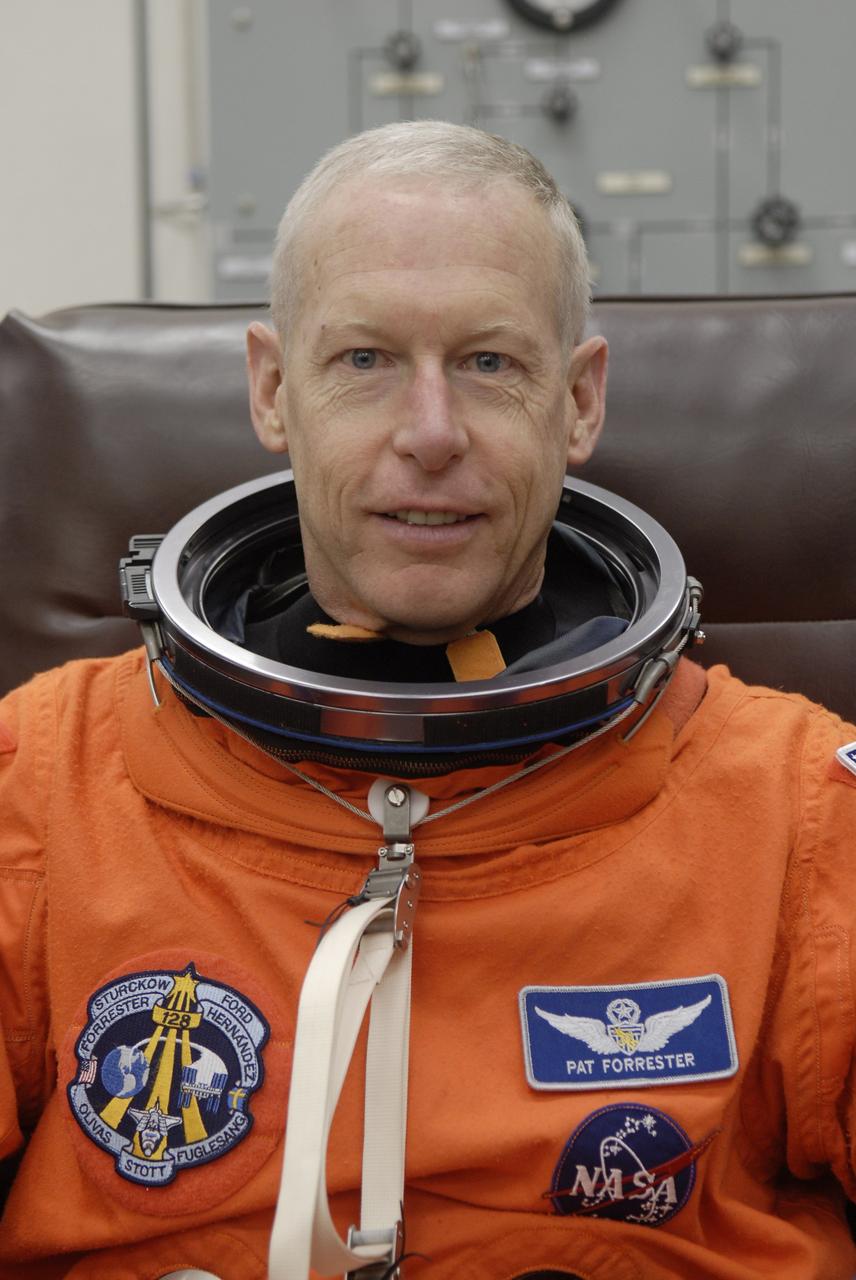 CAPE CANAVERAL, Fla. – In the Operations and Checkout Building at NASA's Kennedy Space Center in Florida, STS-128 crew members put on their launch-and-entry suits before heading to the Astrovan for the 3.4-mile drive to Launch Pad 39A. There, crew members will complete their suitup and enter space shuttle Discovery for the 1:36 a.m. EDT liftoff. Seen here is Mission Specialist Patrick Forrester, who is making his third shuttle flight. The 13-day mission will deliver more than 7 tons of supplies, science racks and equipment, as well as additional environmental hardware to sustain six crew members on the International Space Station. The equipment includes a freezer to store research samples, a new sleeping compartment and the COLBERT treadmill. The mission is the 128th in the Space Shuttle Program, the 37th flight of Discovery and the 30th station assembly flight. Photo credit: NASA/Kim Shiflett