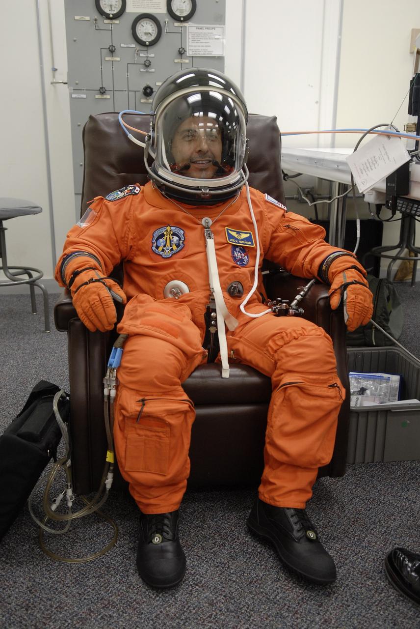 CAPE CANAVERAL, Fla. – In the Operations and Checkout Building at NASA's Kennedy Space Center in Florida, STS-128 crew members put on their launch-and-entry suits before heading to the Astrovan for the 3.4-mile drive to Launch Pad 39A. There, crew members will complete their suitup and enter space shuttle Discovery for the 1:36 a.m. EDT liftoff. Seen here, Mission Specialist Jose Fernandez is ready for launch. The 13-day mission will deliver more than 7 tons of supplies, science racks and equipment, as well as additional environmental hardware to sustain six crew members on the International Space Station. The equipment includes a freezer to store research samples, a new sleeping compartment and the COLBERT treadmill. The mission is the 128th in the Space Shuttle Program, the 37th flight of Discovery and the 30th station assembly flight. Photo credit: NASA/Kim Shiflett