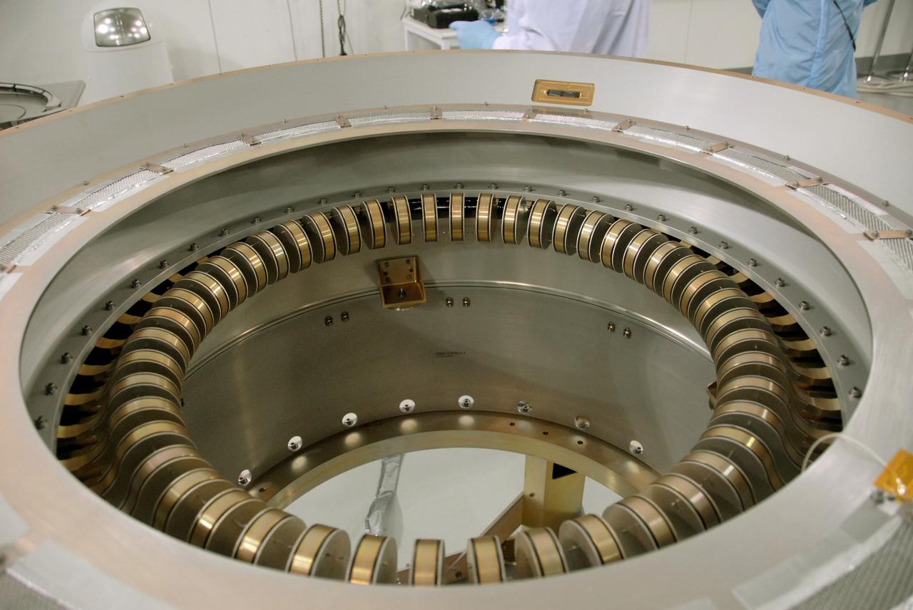 VANDENBERG AIR FORCE BASE, Calif. -- A view of the flexure springs in the soft ride being mated to the payload attach fitting for NASA's Wide-field Infrared Survey Explorer, or WISE, spacecraft.   The satellite will survey the entire sky at infrared wavelengths, creating a cosmic clearinghouse of hundreds of millions of objects, which will be catalogued, providing a vast storehouse of knowledge about the solar system, the Milky Way, and the universe. Launch is scheduled no earlier than Dec. 7. Photo credit: NASA/Doug Kolkow