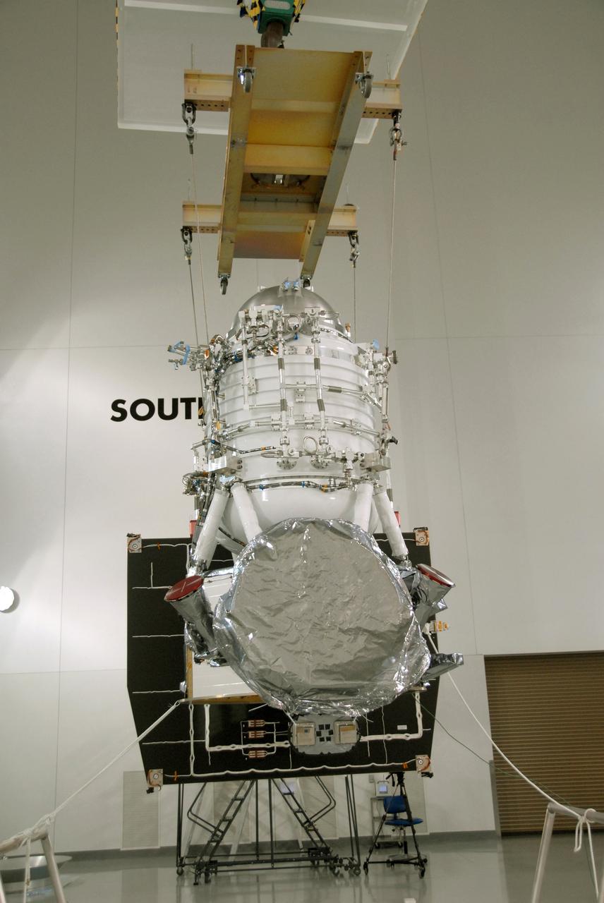 VANDENBERG AIR FORCE BASE, Calif. -- At Vandenberg Air Force Base's Astrotech processing facility in California, NASA's Wide-field Infrared Survey Explorer, or WISE, spacecraft is being moved to the flight conical adapter and test stand. The satellite will survey the entire sky at infrared wavelengths, creating a cosmic clearinghouse of hundreds of millions of objects, which will be catalogued, providing a vast storehouse of knowledge about the solar system, the Milky Way, and the universe. Launch is scheduled no earlier than Dec. 7. Photo credit: NASA/Doug Kolkow