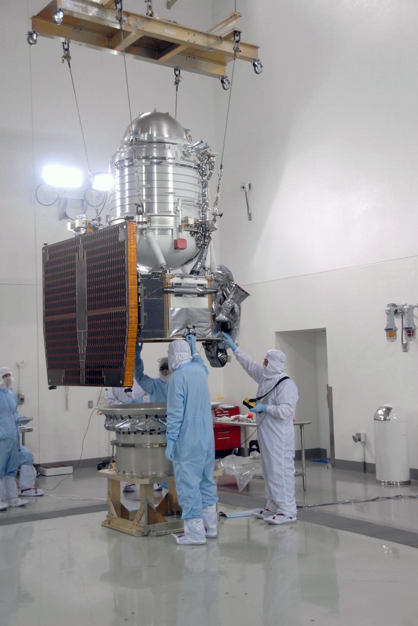 VANDENBERG AIR FORCE BASE, Calif. -- At Vandenberg Air Force Base's Astrotech processing facility in California, NASA's Wide-field Infrared Survey Explorer, or WISE, spacecraft is lowered toward the flight conical adapter and test stand. The satellite will survey the entire sky at infrared wavelengths, creating a cosmic clearinghouse of hundreds of millions of objects, which will be catalogued, providing a vast storehouse of knowledge about the solar system, the Milky Way, and the universe. Launch is scheduled no earlier than Dec. 7. Photo credit: NASA/Doug Kolkow