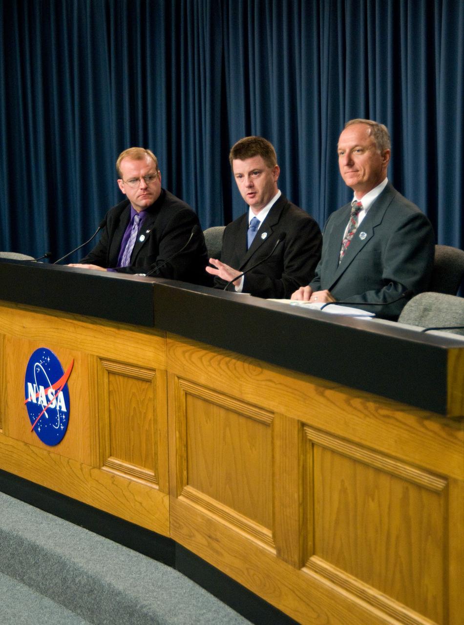 CAPE CANAVERAL, Fla. – In the Press Site auditorium at NASA's Kennedy Space Center in Florida, NASA managers brief the media following the scrub of a launch attempt of space shuttle Discovery. From left are briefing moderator Allard Beutel, Mission Management Team Chair Mike Moses and STS-128 Launch Director Pete Nickolenko.  The launch attempt was scrubbed due to a problem with a liquid hydrogen valve in the main propulsion system. Liftoff now is no earlier than 12:22 a.m. EDT on Aug. 28.The 13-day STS-128 mission will deliver more than seven tons of supplies, science racks and equipment, as well as additional environmental hardware to sustain six crew members on the International Space Station. The equipment includes a freezer to store research samples, a new sleeping compartment and the COLBERT treadmill.  The mission is the 128th in the Space Shuttle Program, the 37th flight of Discovery and the 30th station assembly flight.  Photo credit: NASA/Cory Huston