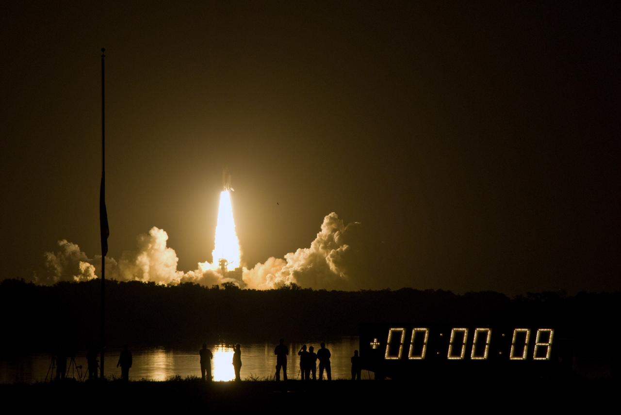 CAPE CANAVERAL, Fla. –   Riding a tower of flames, space shuttle Discovery punches through a fabric of clouds as it roars toward space from NASA's Kennedy Space Center in Florida on the STS-128 mission.  Liftoff from Launch Pad 39A was on time at 11:59 p.m. EDT. The first launch attempt on Aug. 24 was postponed due to unfavorable weather conditions.  The second attempt on Aug. 25 also was postponed due to an issue with a valve in space shuttle Discovery's main propulsion system.  The STS-128 mission is the 30th International Space Station assembly flight and the 128th space shuttle flight. The 13-day mission will deliver more than 7 tons of supplies, science racks and equipment, as well as additional environmental hardware to sustain six crew members on the International Space Station. The equipment includes a freezer to store research samples, a new sleeping compartment and the COLBERT treadmill.  Photo credit: NASA/Jim Grossmann