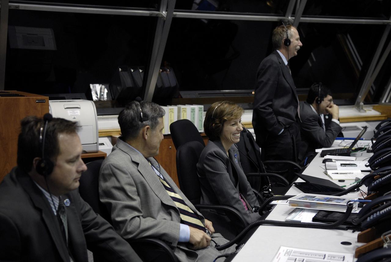 CAPE CANAVERAL, Fla. –  In NASA Kennedy Space Center's Firing Room 4, NASA management relish the successful launch of space shuttle Discovery on the STS-128 mission.  From left are Robert Lightfoot, director of NASA's Marshall Space Flight Center; Bob Cabana, director of Kennedy Space Center; Janet Kavandi, deputy director of Flight Crew Operations at Johnson Space Center; Bill Gerstenmaier, associate administrator for Space Operations; and Chris Scolese, NASA associate administrator.  Liftoff from Launch Pad 39A was on time at 11:59 p.m. EDT. The first launch attempt on Aug. 24 was postponed due to unfavorable weather conditions.  The second attempt on Aug. 25 also was postponed due to an issue with a valve in space shuttle Discovery's main propulsion system.  The STS-128 mission is the 30th International Space Station assembly flight and the 128th space shuttle flight. The 13-day mission will deliver more than 7 tons of supplies, science racks and equipment, as well as additional environmental hardware to sustain six crew members on the International Space Station. The equipment includes a freezer to store research samples, a new sleeping compartment and the COLBERT treadmill.  Photo credit: NASA/Kim Shiflett
