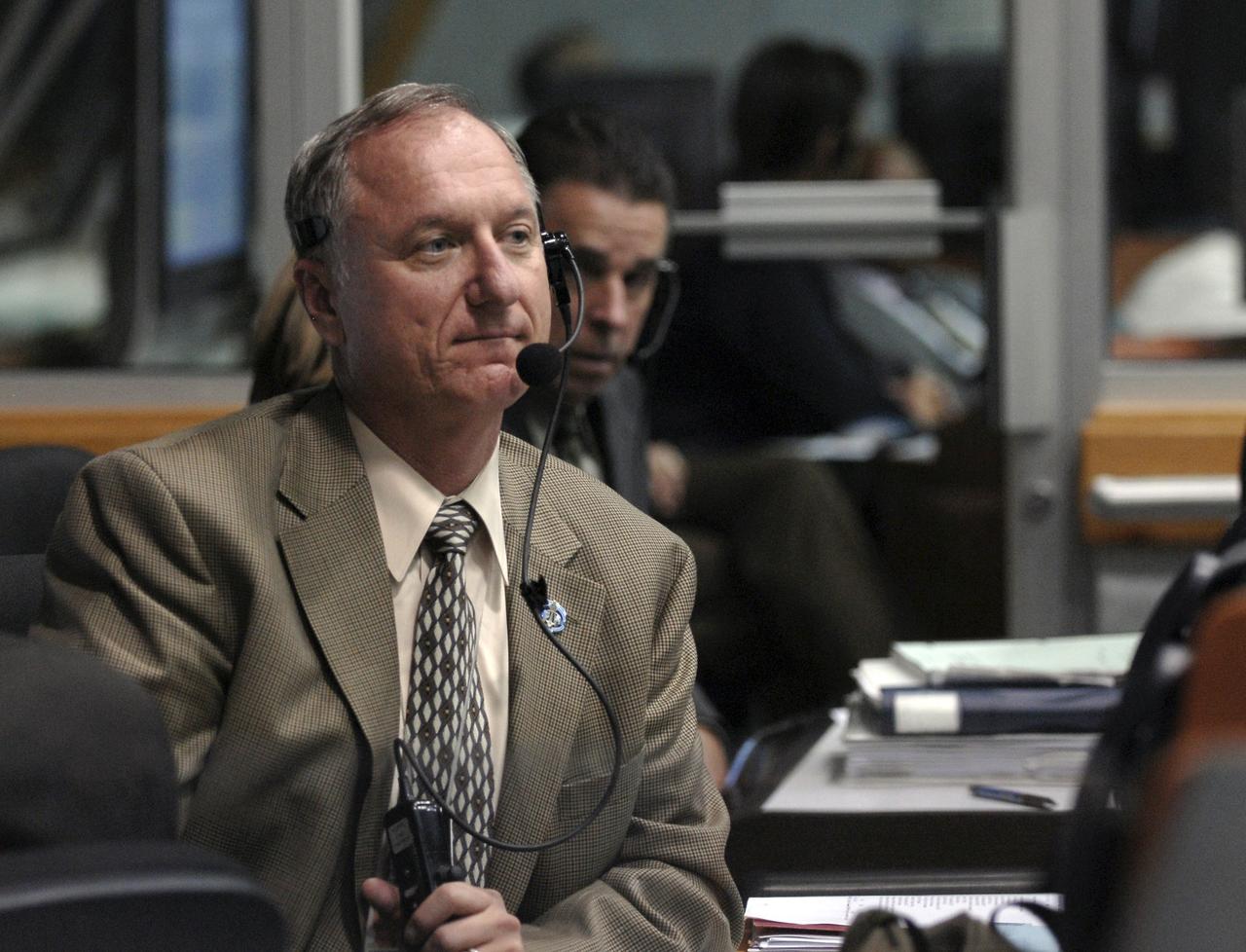 CAPE CANAVERAL, Fla. –  In NASA Kennedy Space Center's Firing Room 4, STS-128  Launch Director Pete Nickolenko waits for the launch of space shuttle Discovery on the STS-128 mission. Liftoff from Launch Pad 39A was on time at 11:59 p.m. EDT. The first launch attempt on Aug. 24 was postponed due to unfavorable weather conditions.  The second attempt on Aug. 25 also was postponed due to an issue with a valve in space shuttle Discovery's main propulsion system.  The STS-128 mission is the 30th International Space Station assembly flight and the 128th space shuttle flight. The 13-day mission will deliver more than 7 tons of supplies, science racks and equipment, as well as additional environmental hardware to sustain six crew members on the International Space Station. The equipment includes a freezer to store research samples, a new sleeping compartment and the COLBERT treadmill.  Photo credit: NASA/Kim Shiflett