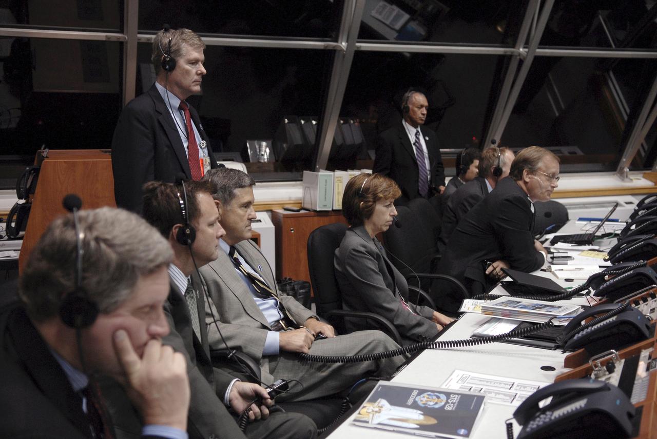 CAPE CANAVERAL, Fla. – In NASA Kennedy Space Center's Firing Room 4, NASA management watch the console during the countdown toward launch of space shuttle Discovery on the STS-128 mission. Seated (starting second from left) are Robert Lightfoot, director of NASA's Marshall Space Flight Center; Bob Cabana, director of Kennedy Space Center; Janet Kavandi, deputy director of Flight Crew Operations at Johnson Space Center; John Shannon, Shuttle Program manager (leaning forward); Bill Gerstenmaier, associate administrator for Space Operations; and Chris Scolese, NASA associate administrator. Standing in front of the windows at right is Charles Bolden, NASA Administrator. Liftoff from Launch Pad 39A was on time at 11:59 p.m. EDT. The first launch attempt on Aug. 24 was postponed due to unfavorable weather conditions. The second attempt on Aug. 25 also was postponed due to an issue with a valve in space shuttle Discovery's main propulsion system. The STS-128 mission is the 30th International Space Station assembly flight and the 128th space shuttle flight. The 13-day mission will deliver more than 7 tons of supplies, science racks and equipment, as well as additional environmental hardware to sustain six crew members on the International Space Station. The equipment includes a freezer to store research samples, a new sleeping compartment and the COLBERT treadmill. Photo credit: NASA/Kim Shiflett