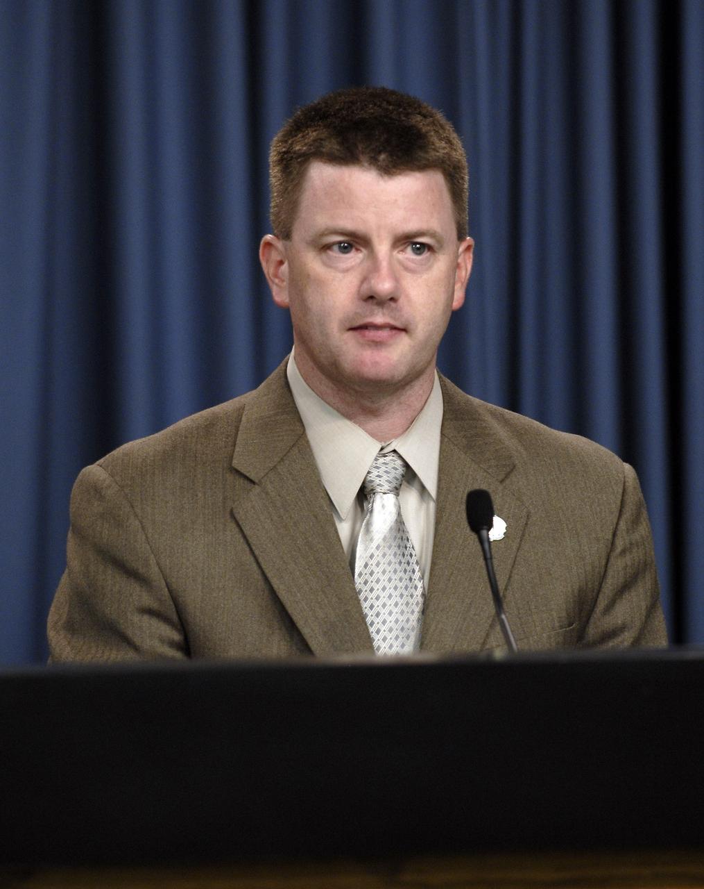 CAPE CANAVERAL, Fla. – In the Press Site auditorium at NASA's Kennedy Space Center in Florida, Mission Management Team Chair Mike Moses discusses the successful launch of space shuttle Discovery on the STS-128 mission. Liftoff from Launch Pad 39A was on time at 11:59 p.m. EDT. The first launch attempt on Aug. 24 was postponed due to unfavorable weather conditions. The second attempt on Aug. 25 also was postponed due to an issue with a valve in space shuttle Discovery's main propulsion system. The STS-128 mission is the 30th International Space Station assembly flight and the 128th space shuttle flight. The 13-day mission will deliver more than 7 tons of supplies, science racks and equipment, as well as additional environmental hardware to sustain six crew members on the International Space Station. The equipment includes a freezer to store research samples, a new sleeping compartment and the COLBERT treadmill. Photo credit: NASA/Kim Shiflett