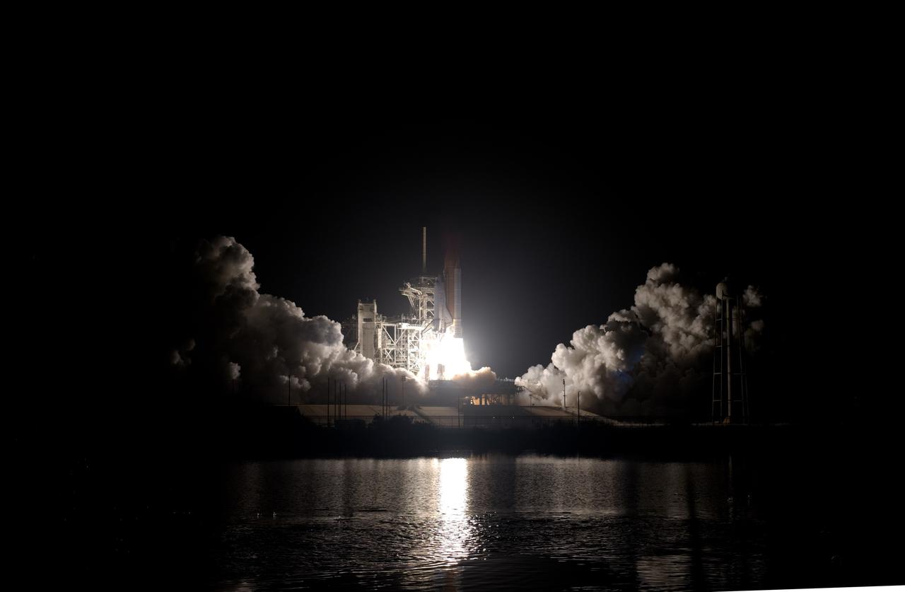 CAPE CANAVERAL, Fla. –  At NASA's Kennedy Space Center in Florida, steam and smoke billow in the light from space shuttle Discovery's fiery launch on the STS-128 mission. Liftoff from Launch Pad 39A was on time at 11:59 p.m. EDT. The first launch attempt on Aug. 24 was postponed due to unfavorable weather conditions.  The second attempt on Aug. 25 also was postponed due to an issue with a valve in space shuttle Discovery's main propulsion system.  The STS-128 mission is the 30th International Space Station assembly flight and the 128th space shuttle flight. The 13-day mission will deliver more than 7 tons of supplies, science racks and equipment, as well as additional environmental hardware to sustain six crew members on the International Space Station. The equipment includes a freezer to store research samples, a new sleeping compartment and the COLBERT treadmill.  Photo credit: NASA/Sandra Joseph-Kevin O'Connell