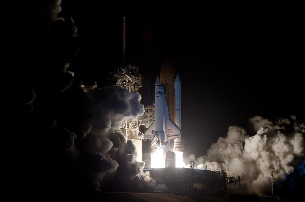 CAPE CANAVERAL, Fla. –   Brilliant flames spread light across Launch Pad 39A at NASA's Kennedy Space Center in Florida as space shuttle Discovery roars toward space on the STS-128 mission. Liftoff from Launch Pad 39A was on time at 11:59 p.m. EDT. The first launch attempt on Aug. 24 was postponed due to unfavorable weather conditions.  The second attempt on Aug. 25 also was postponed due to an issue with a valve in space shuttle Discovery's main propulsion system.  The STS-128 mission is the 30th International Space Station assembly flight and the 128th space shuttle flight. The 13-day mission will deliver more than 7 tons of supplies, science racks and equipment, as well as additional environmental hardware to sustain six crew members on the International Space Station. The equipment includes a freezer to store research samples, a new sleeping compartment and the COLBERT treadmill.  Photo credit: NASA/Sandra Joseph-Kevin O'Connell