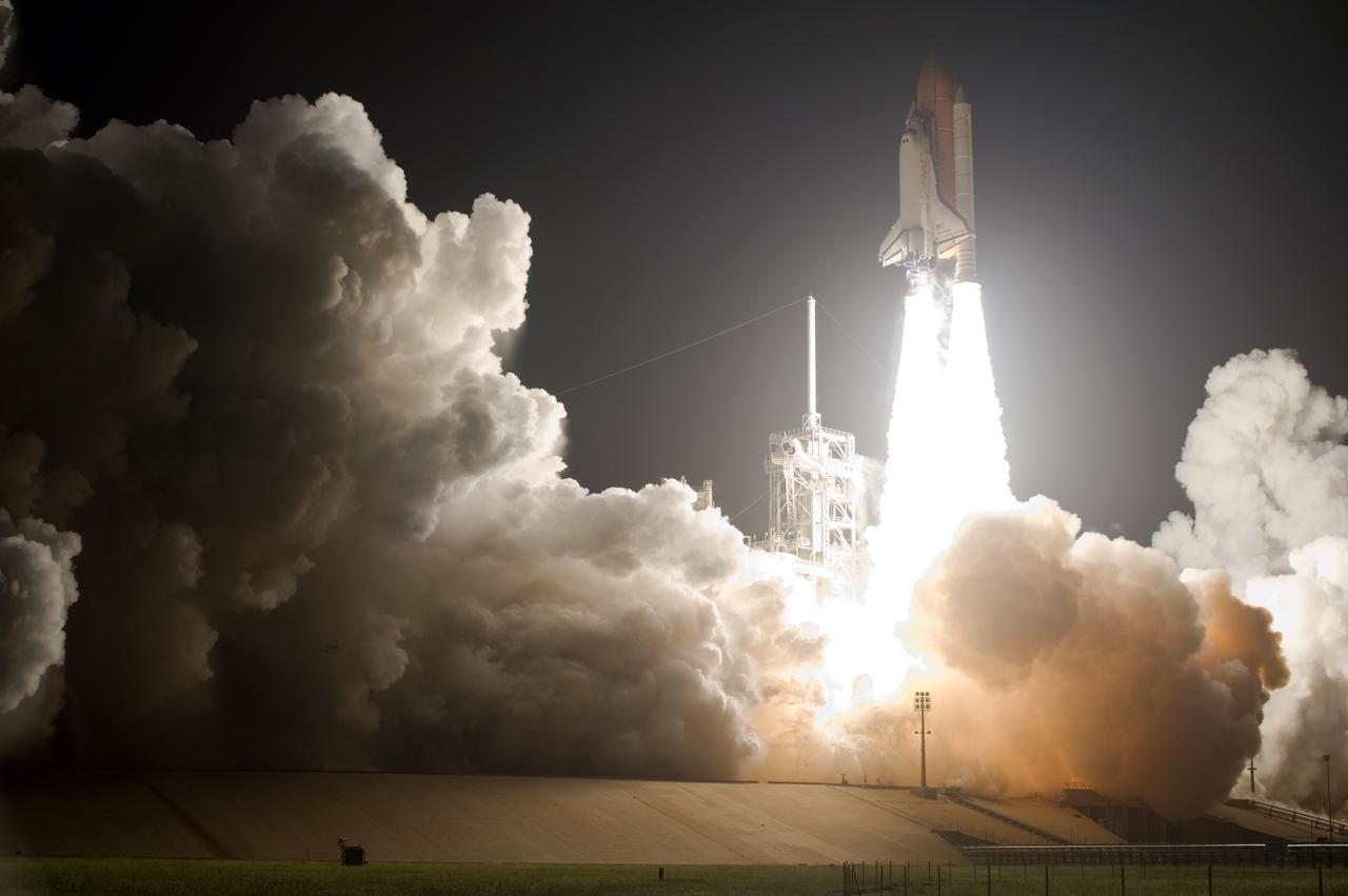 CAPE CANAVERAL, Fla. – Brilliant flames spread light across Launch Pad 39A at NASA's Kennedy Space Center in Florida as space shuttle Discovery roars toward space on the STS-128 mission. Liftoff from Launch Pad 39A was on time at 11:59 p.m. EDT. The first launch attempt on Aug. 24 was postponed due to unfavorable weather conditions.  The second attempt on Aug. 25 also was postponed due to an issue with a valve in space shuttle Discovery's main propulsion system.  The STS-128 mission is the 30th International Space Station assembly flight and the 128th space shuttle flight. The 13-day mission will deliver more than 7 tons of supplies, science racks and equipment, as well as additional environmental hardware to sustain six crew members on the International Space Station. The equipment includes a freezer to store research samples, a new sleeping compartment and the COLBERT treadmill.  Photo credit: NASA/Sandra Joseph-Kevin O'Connell
