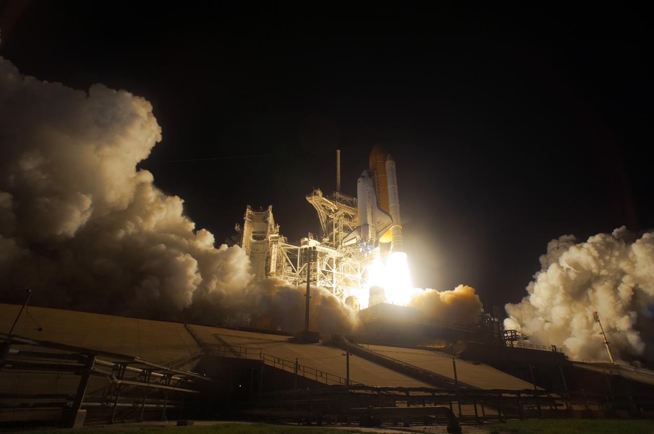 CAPE CANAVERAL, Fla. – On Launch Pad 39A at NASA's Kennedy Space Center in Florida, the brilliant flames beneath space shuttle Discovery light the night as it races toward space on the STS-128 mission. Liftoff from Launch Pad 39A was on time at 11:59 p.m. EDT. The first launch attempt on Aug. 24 was postponed due to unfavorable weather conditions. The second attempt on Aug. 25 also was postponed due to an issue with a valve in space shuttle Discovery's main propulsion system. The STS-128 mission is the 30th International Space Station assembly flight and the 128th space shuttle flight. The 13-day mission will deliver more than 7 tons of supplies, science racks and equipment, as well as additional environmental hardware to sustain six crew members on the International Space Station. The equipment includes a freezer to store research samples, a new sleeping compartment and the COLBERT treadmill. Photo credit: NASA/Sandra Joseph-Kevin O'Connell