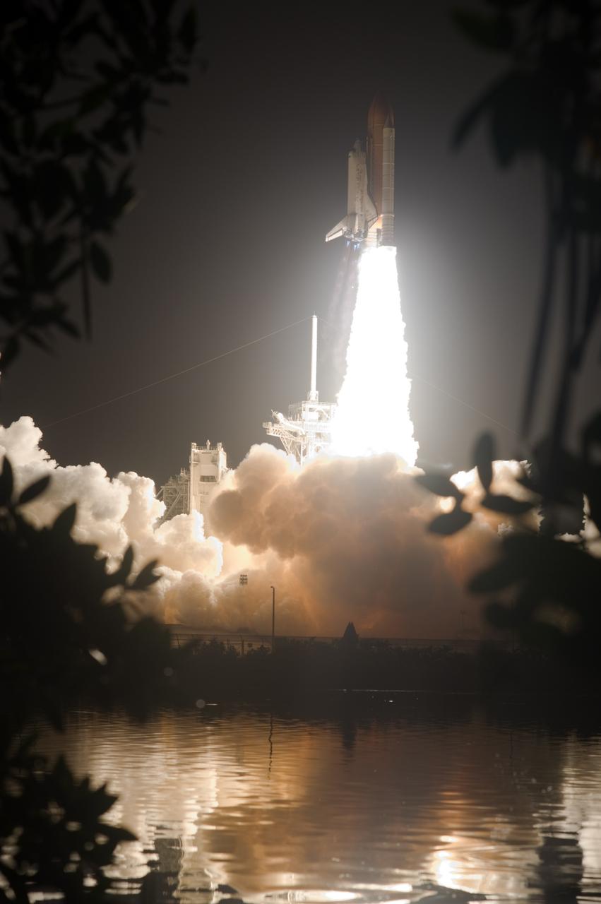 CAPE CANAVERAL, Fla. – Brilliant flames spread light across Launch Pad 39A at NASA's Kennedy Space Center in Florida as space shuttle Discovery roars toward space on the STS-128 mission. Liftoff was on time at 11:59 p.m. EDT. The first launch attempt on Aug. 24 was postponed due to unfavorable weather conditions.  The second attempt on Aug. 25 also was postponed due to an issue with a valve in space shuttle Discovery's main propulsion system.  The STS-128 mission is the 30th International Space Station assembly flight and the 128th space shuttle flight. The 13-day mission will deliver more than 7 tons of supplies, science racks and equipment, as well as additional environmental hardware to sustain six crew members on the International Space Station. The equipment includes a freezer to store research samples, a new sleeping compartment and the COLBERT treadmill.  Photo credit: NASA/Sandra Joseph-Kevin O'Connell