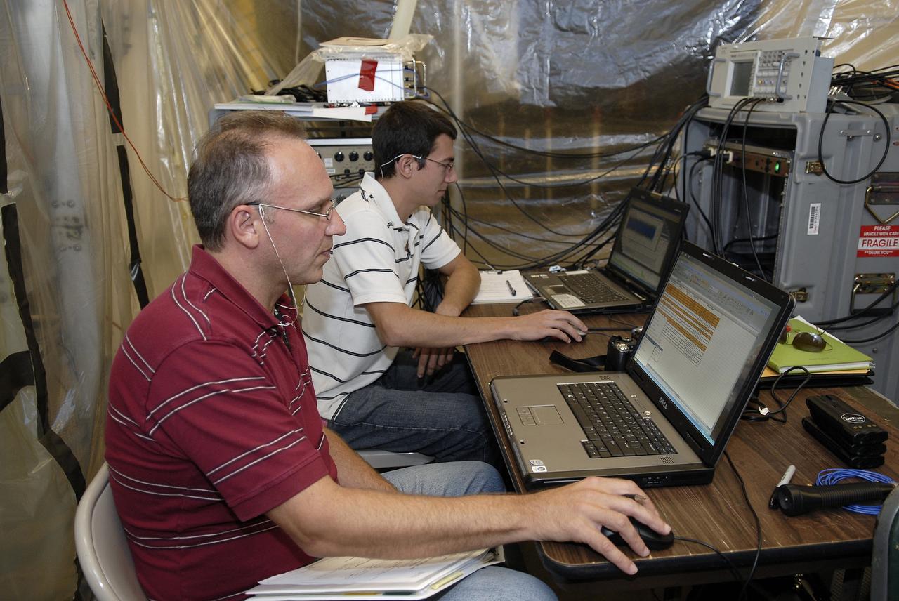 CAPE CANAVERAL, Fla. – In the Vehicle Assembly Building's High Bay 4 at NASA's Kennedy Space Center in Florida, technicians are monitoring a sway test on the Ares I-X launch vehicle. The test is simulating conditions the rocket could experience during rollout to Launch Pad 39B, wind conditions at the pad and first-stage ignition. During the test, vibrations are mechanically induced into the rocket by four hydraulic shakers and a sway is manually introduced for lateral motion to measure the vehicle's response. A total of 44 accelerometers are installed on the flight test vehicle that required more than 27,000 feet of cable. Part of the Constellation Program, the Ares I-X is the test vehicle for the Ares I, which is the essential core of a space transportation system that eventually will carry crewed missions back to the moon, on to Mars and out into the solar system . The Ares I-X flight test is targeted for Oct. 31. Photo credit: NASA/Kim Shiflett