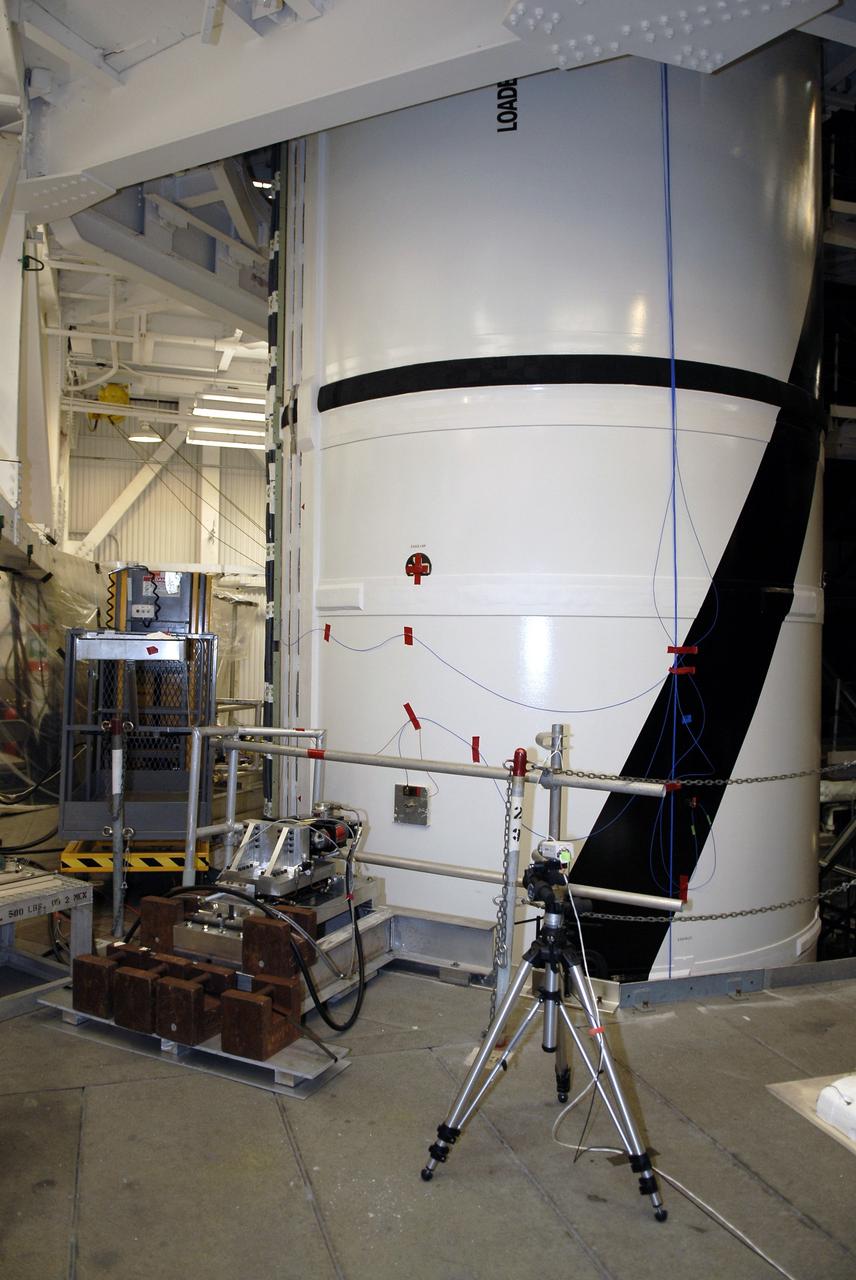 CAPE CANAVERAL, Fla. – In the Vehicle Assembly Building's High Bay 4 at NASA's Kennedy Space Center in Florida, equipment is set up to conduct a sway test on the Ares I-X launch vehicle. The test is simulating conditions the rocket could experience during rollout to Launch Pad 39B, wind conditions at the pad and first-stage ignition. During the test, vibrations are mechanically induced into the rocket by four hydraulic shakers and a sway is manually introduced for lateral motion to measure the vehicle's response. A total of 44 accelerometers are installed on the flight test vehicle that required more than 27,000 feet of cable. Part of the Constellation Program, the Ares I-X is the test vehicle for the Ares I, which is the essential core of a space transportation system that eventually will carry crewed missions back to the moon, on to Mars and out into the solar system . The Ares I-X flight test is targeted for Oct. 31. Photo credit: NASA/Kim Shiflett
